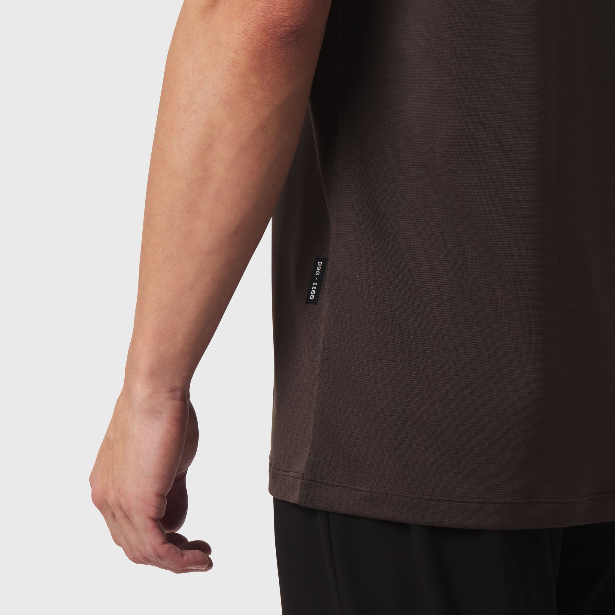 Polartec® Delta Polo in Dark Earth, worn by model showing side arm detail