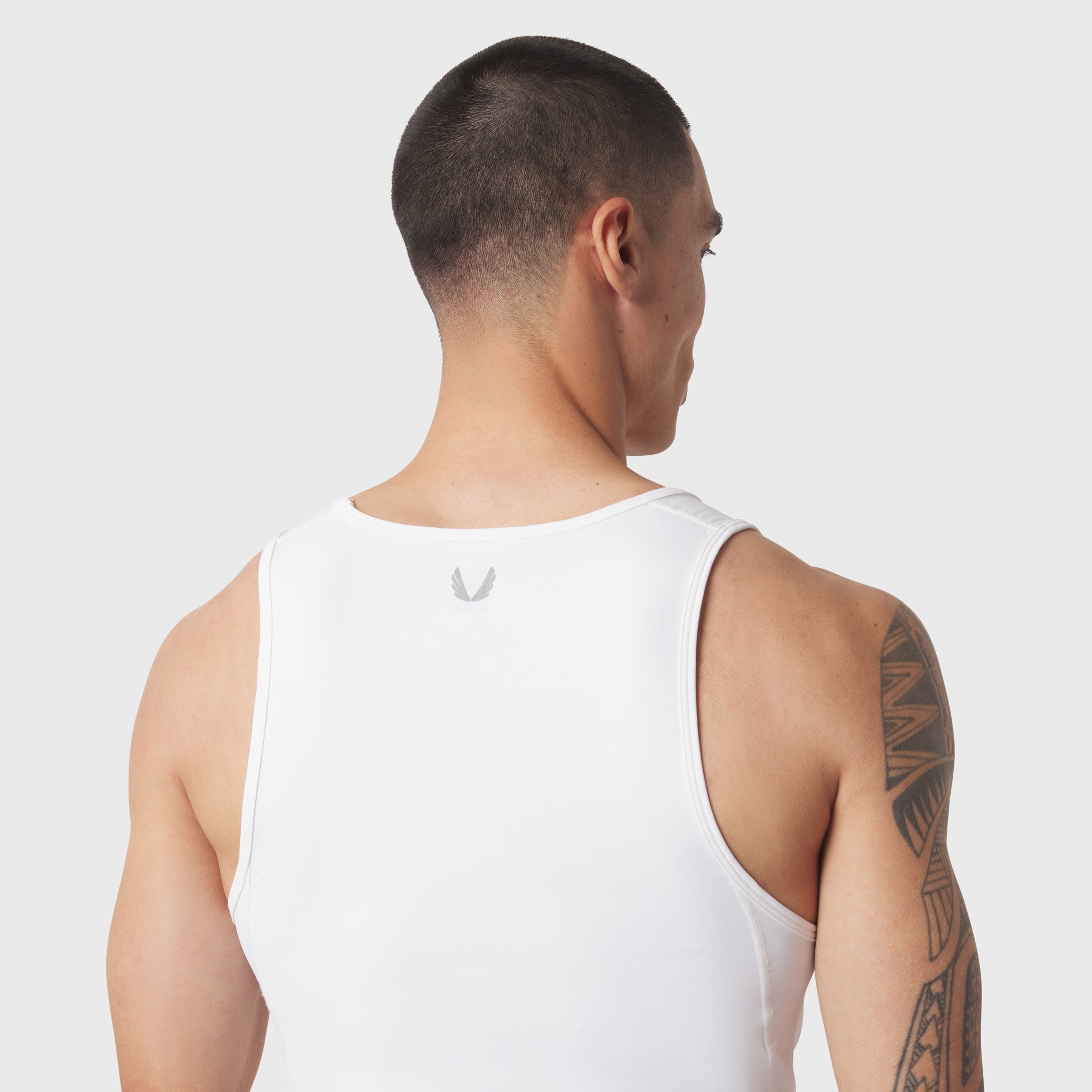 LYCRA® ADAPTIV Baselayer Tank in white, rear view on model