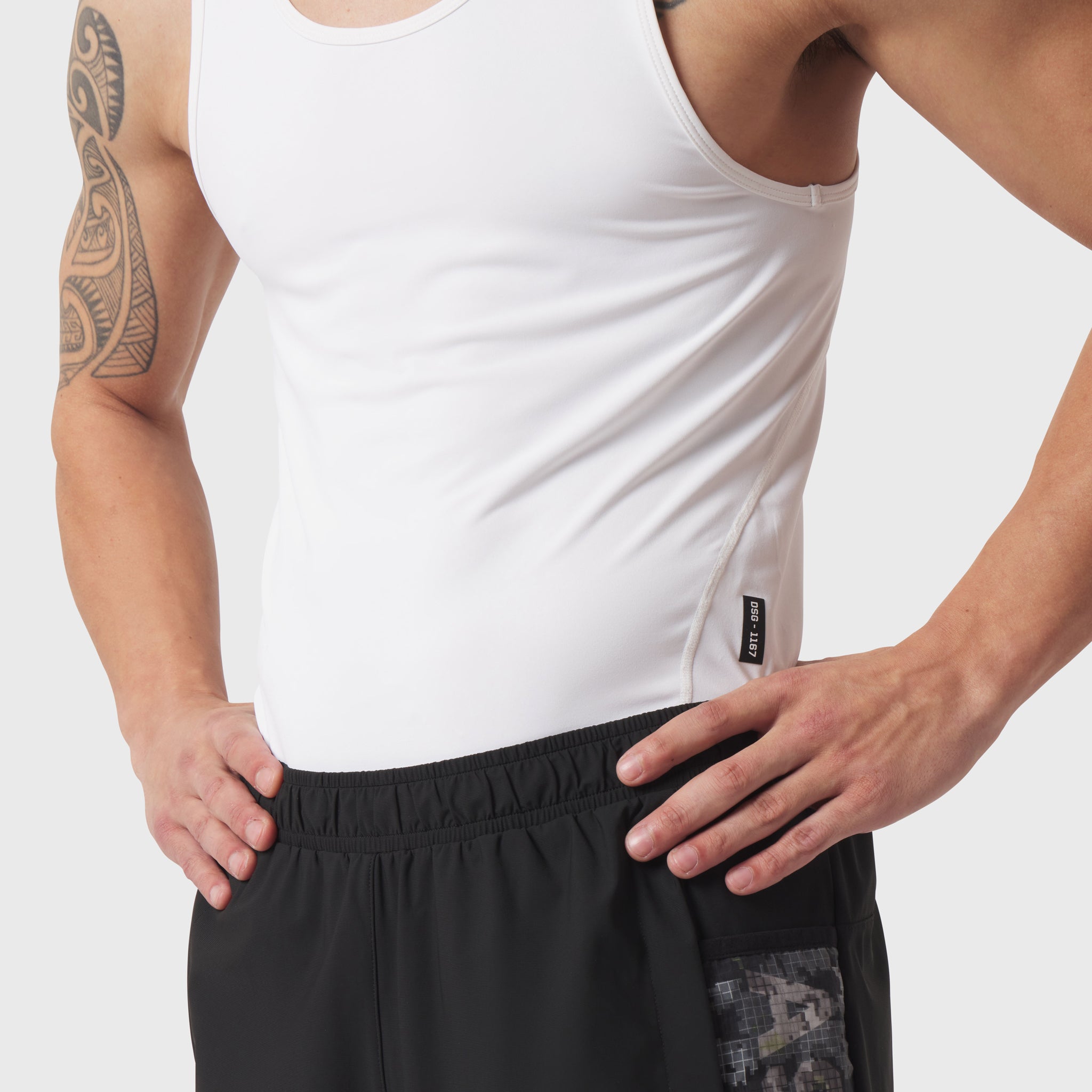 LYCRA® ADAPTIV Baselayer Tank in white, worn by model showing front and side view