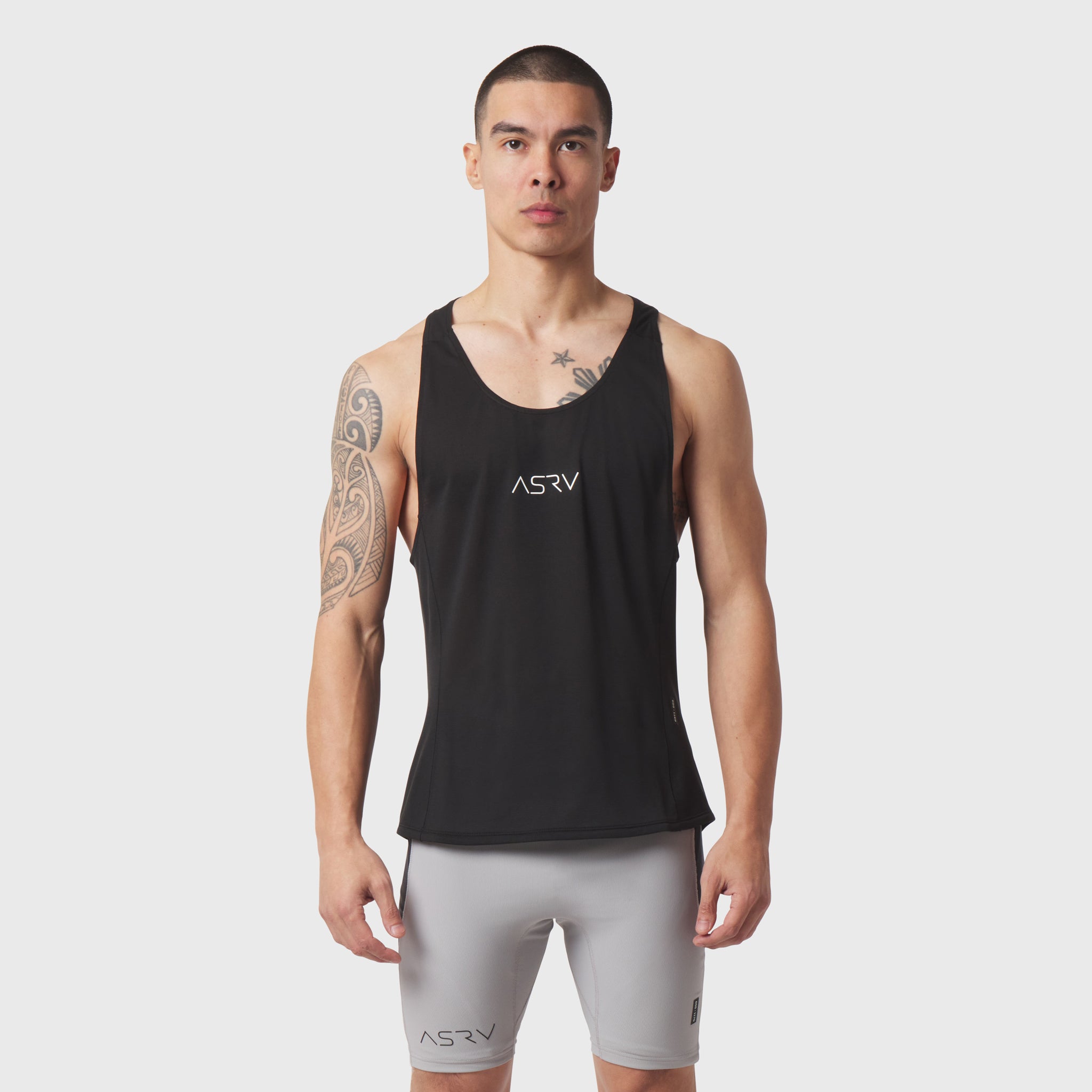 Polartec® Delta Singlet in black worn by male model with grey shorts, front view