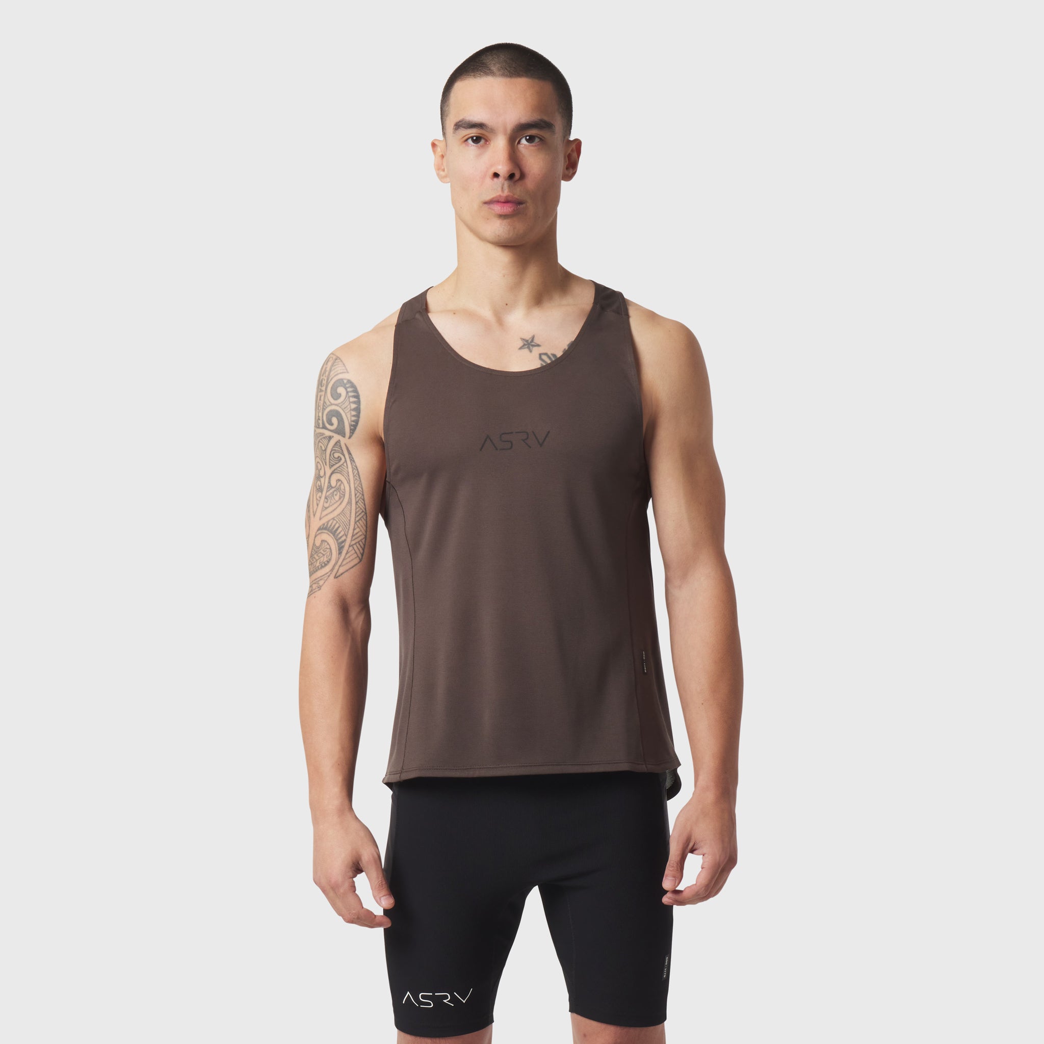 Polartec® Delta Singlet in dark earth, worn by model with hands at sides