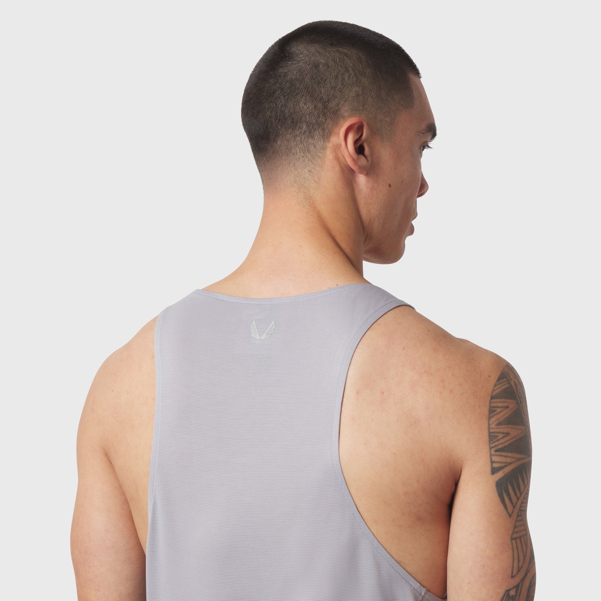 Polartec® Delta Singlet in slate grey, worn by model shown from behind