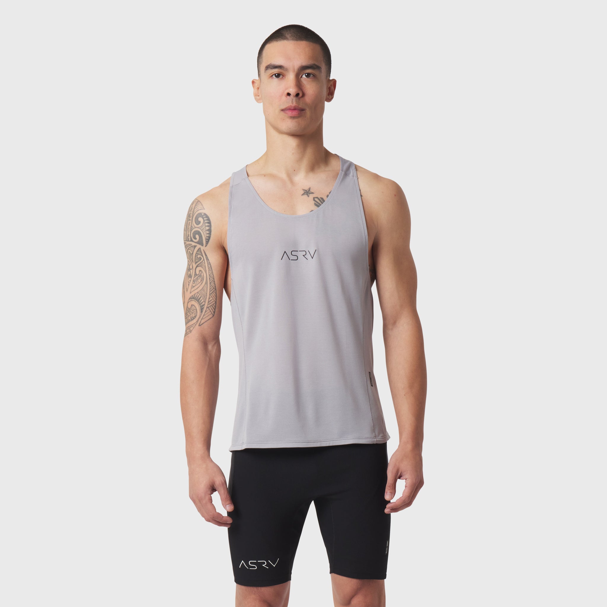 Polartec® Delta Singlet in slate grey worn by male model with black shorts, front view