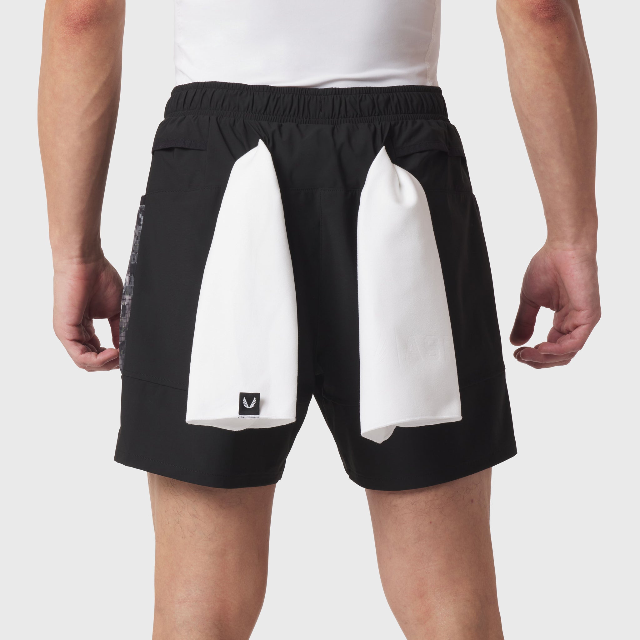 Tetra-Lite Adventure Short in black with white side panels, worn by model, back view