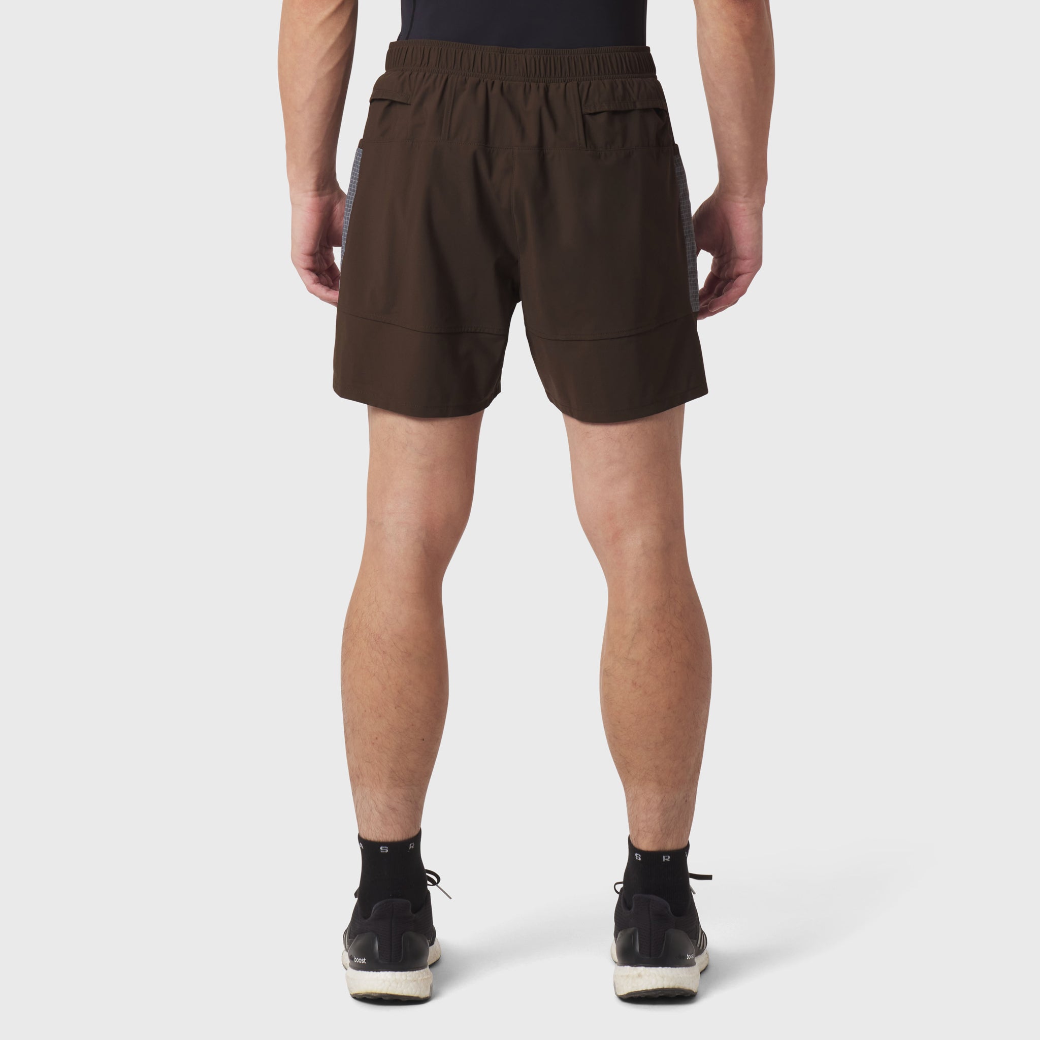 Tetra-Lite® Adventure Short in Dark Earth, rear view on model wearing black socks and sneakers