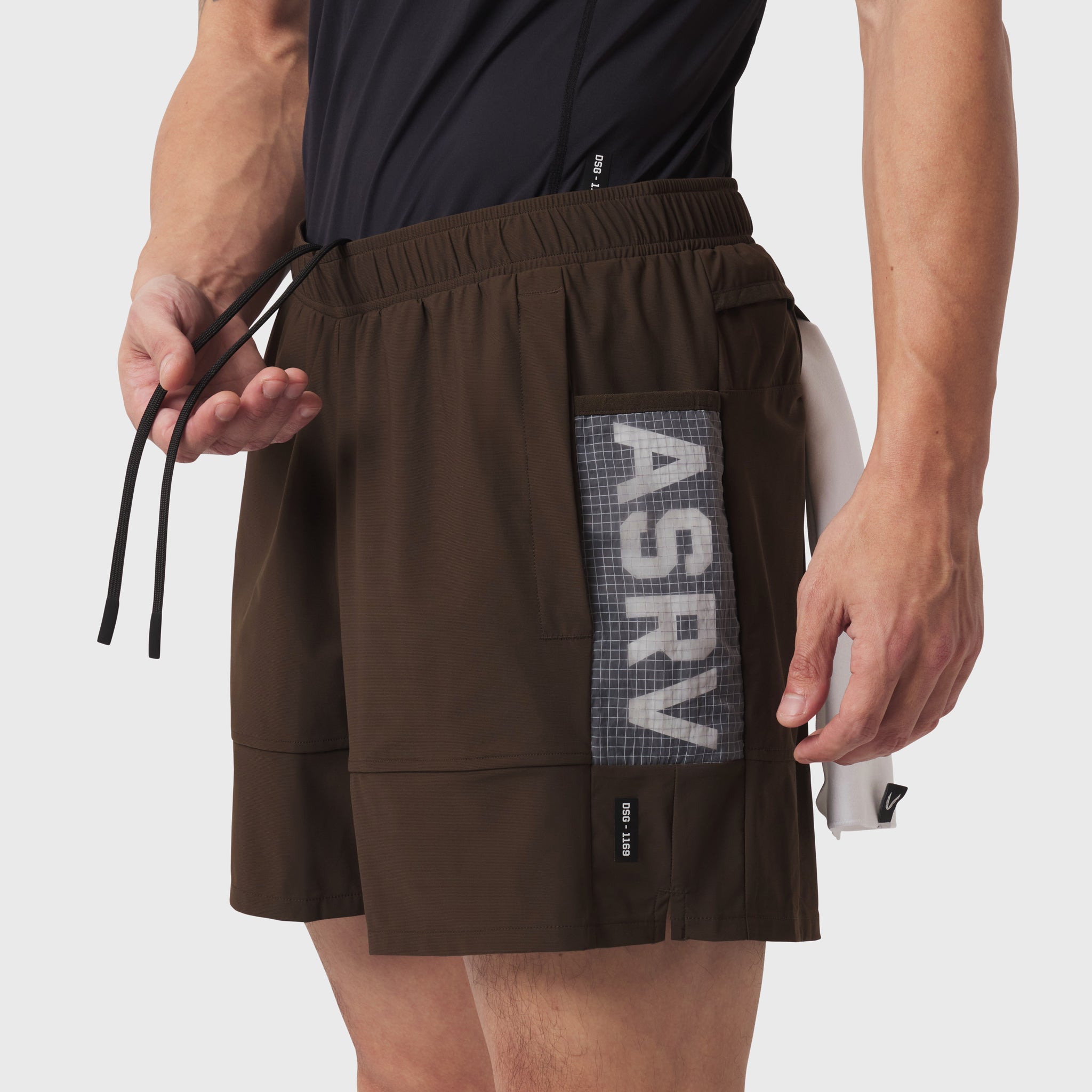 Tetra-Lite Adventure Short in Dark Earth worn by model, side view with drawstring detail
