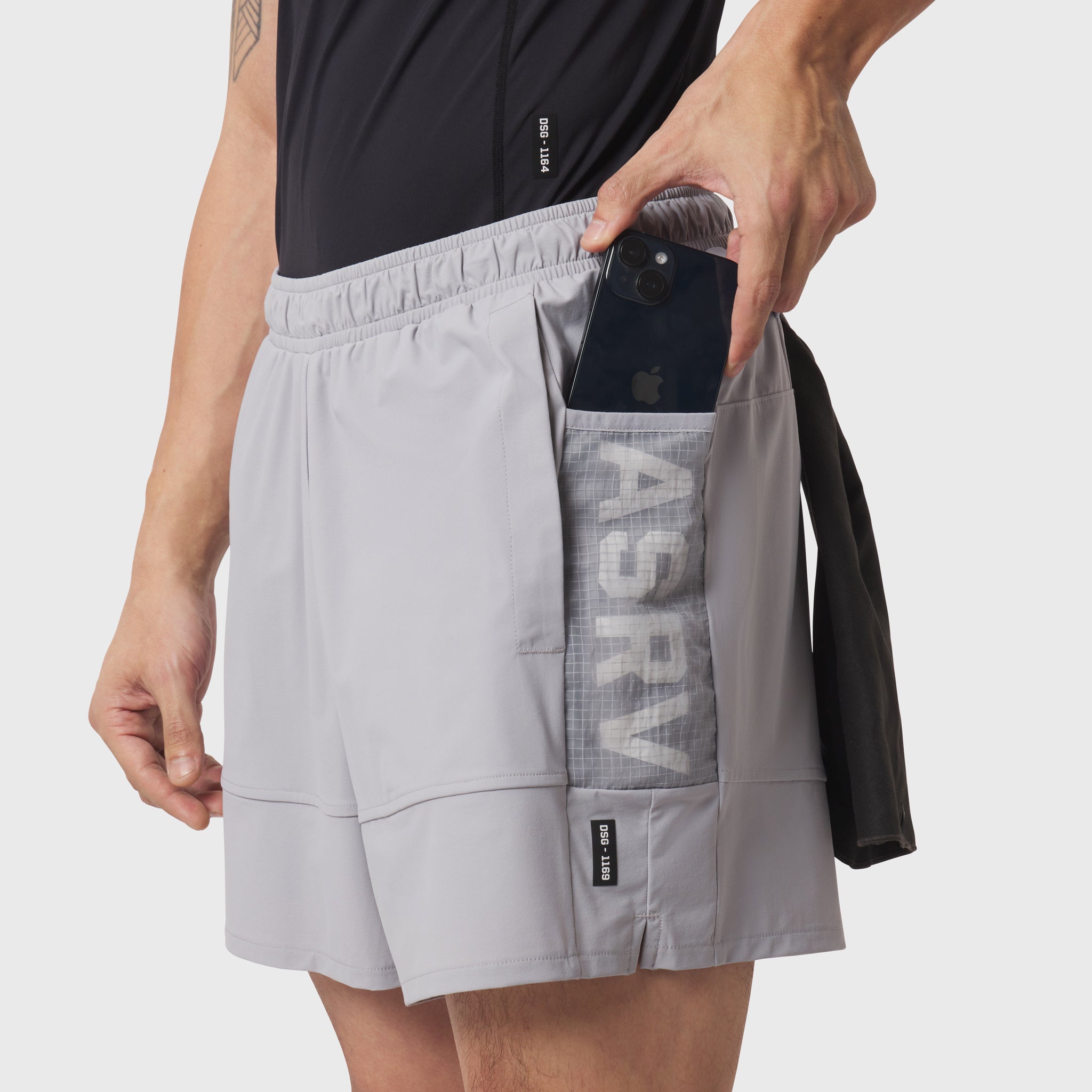 Tetra-Lite Adventure Short in Slate Grey worn by model, demonstrating side pocket with phone