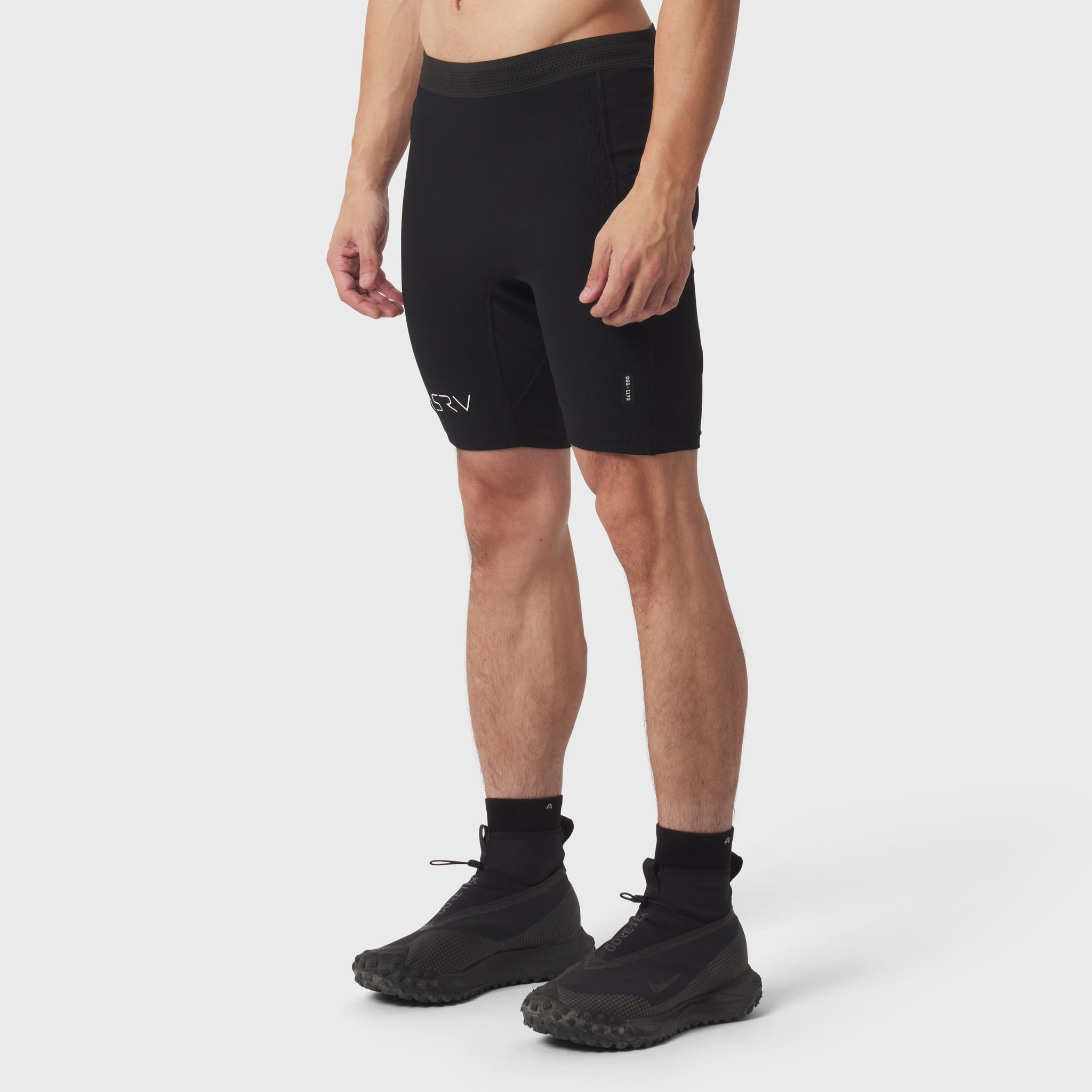Black Lycra Ribbed Run Half-Tight shorts on model, front view with black socks