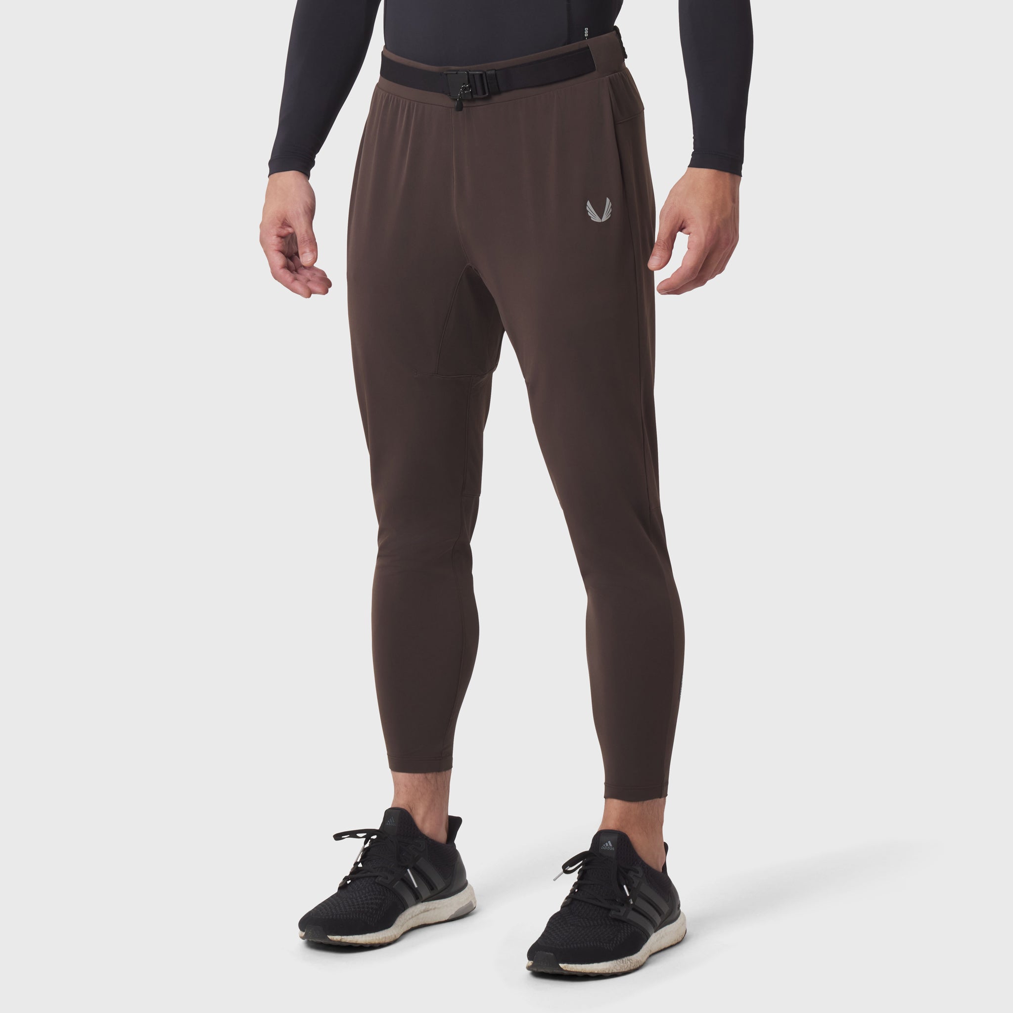 Hybrid Belt-Pack Run Jogger in dark earth worn by male model, front view