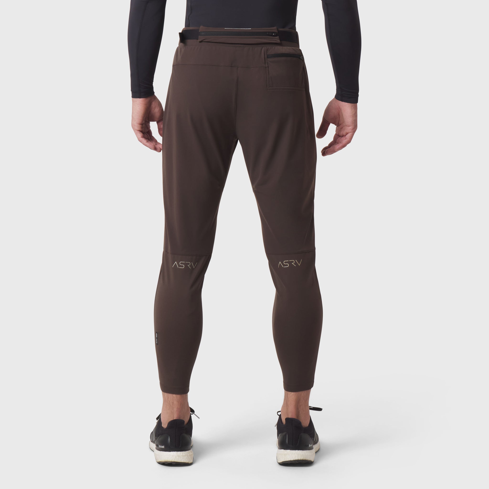Hybrid Belt-Pack Run Jogger in dark earth, back view on model