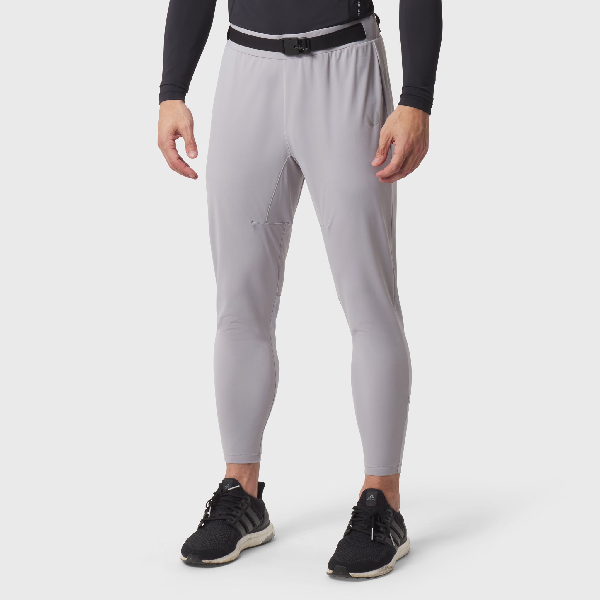 Slate grey hybrid belt-pack run jogger worn by model with black sneakers, front view