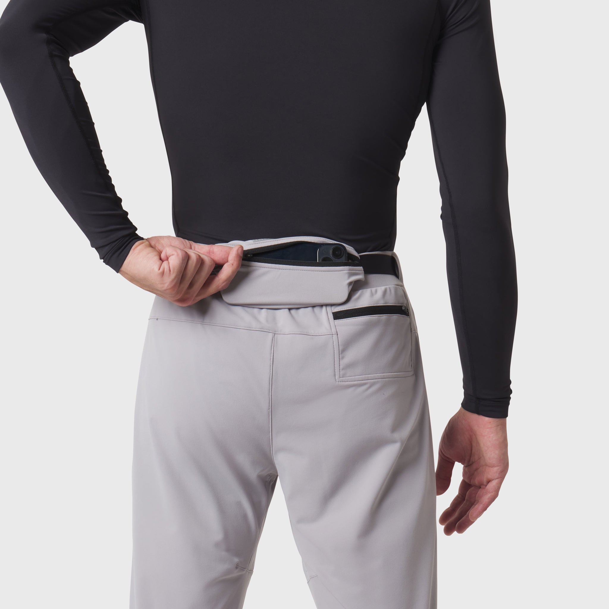 Hybrid Belt-Pack Run Jogger in slate grey, worn by model showing waistband detail and belt pack