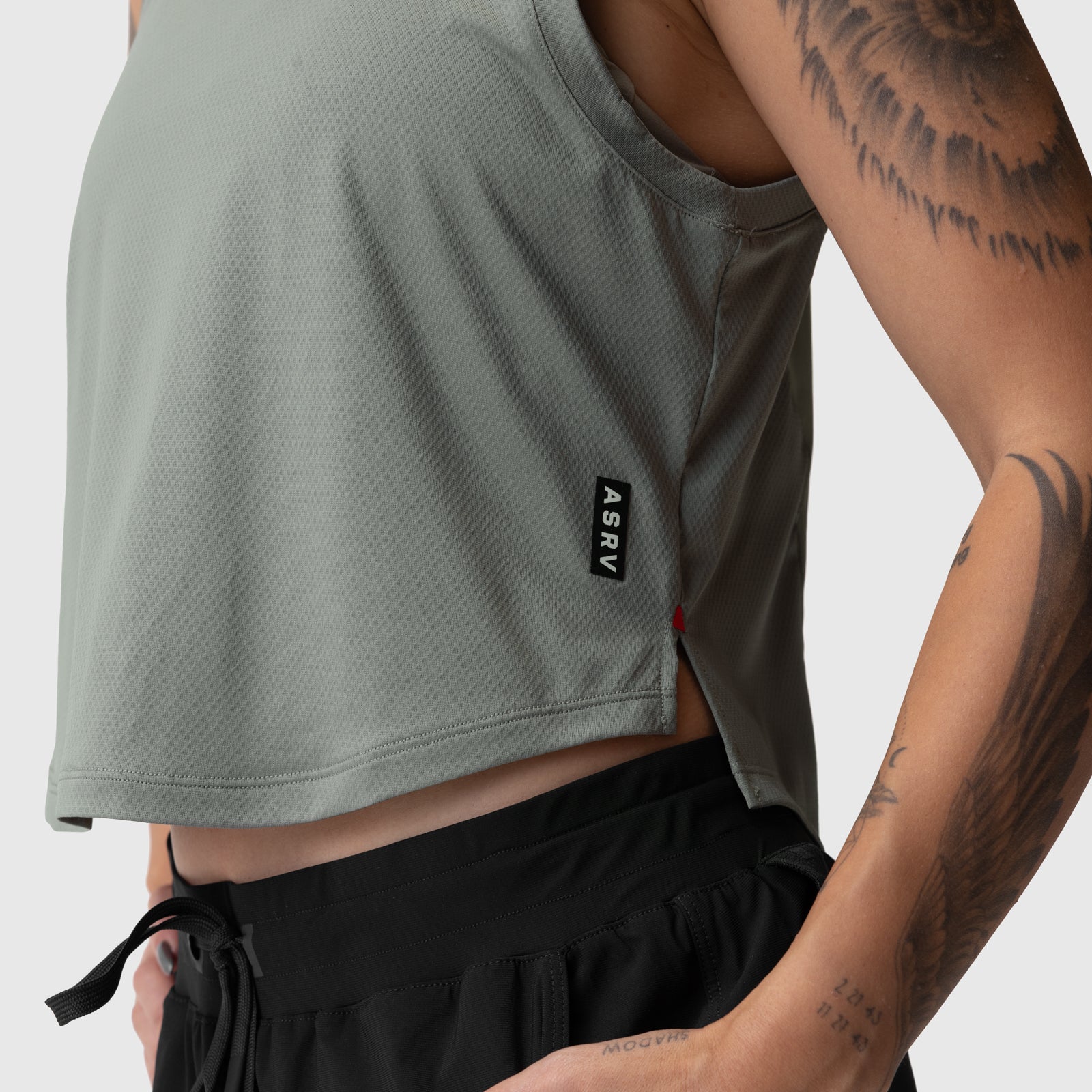 ASRV AeroSilver cropped training tank in sage, worn by model showing front view