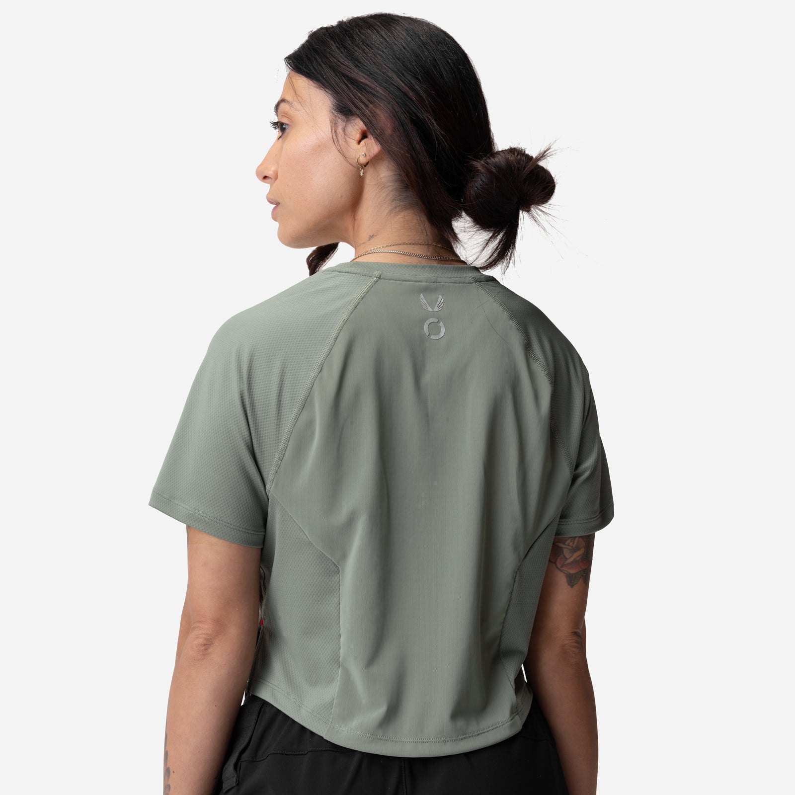 ASRV AeroSilver Cropped Training Tee in sage, worn by model, back view