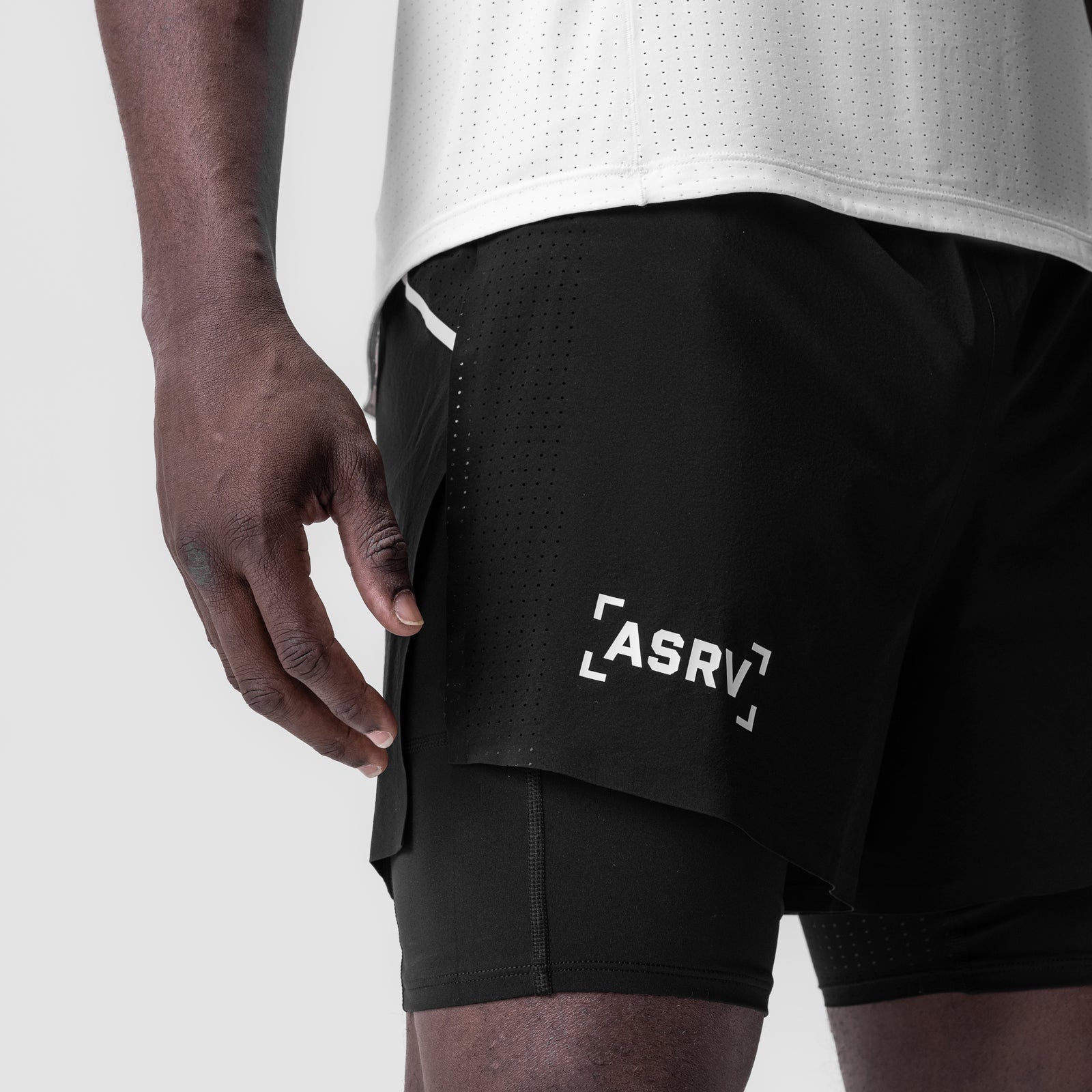 Aerotex 4" High Split Liner Short in black with white trim, worn by model, side view