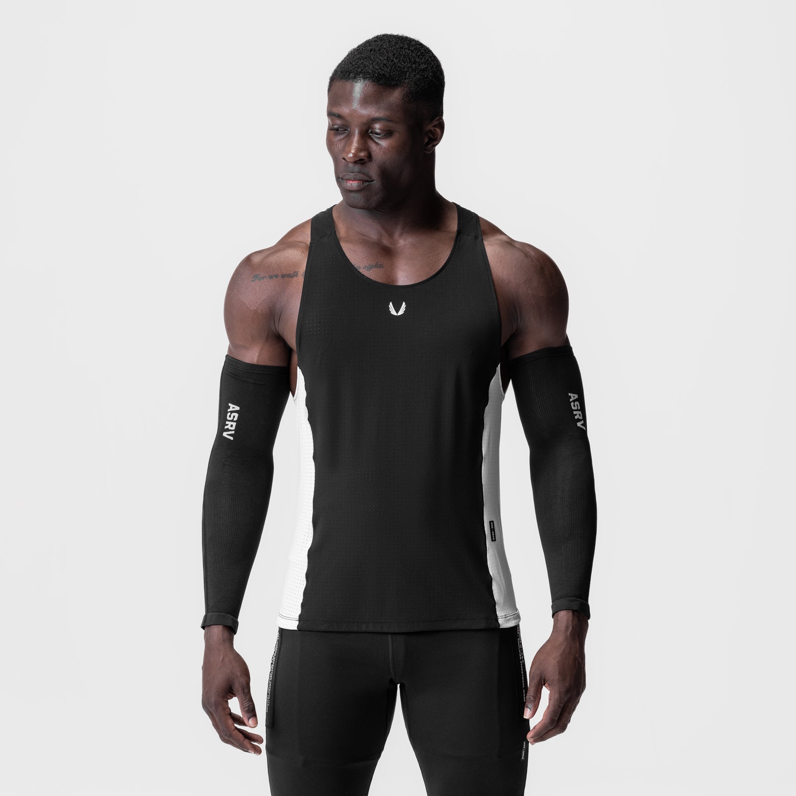 Black and white Laser-Vent Singlet Tank worn with black arm sleeves, front view on model