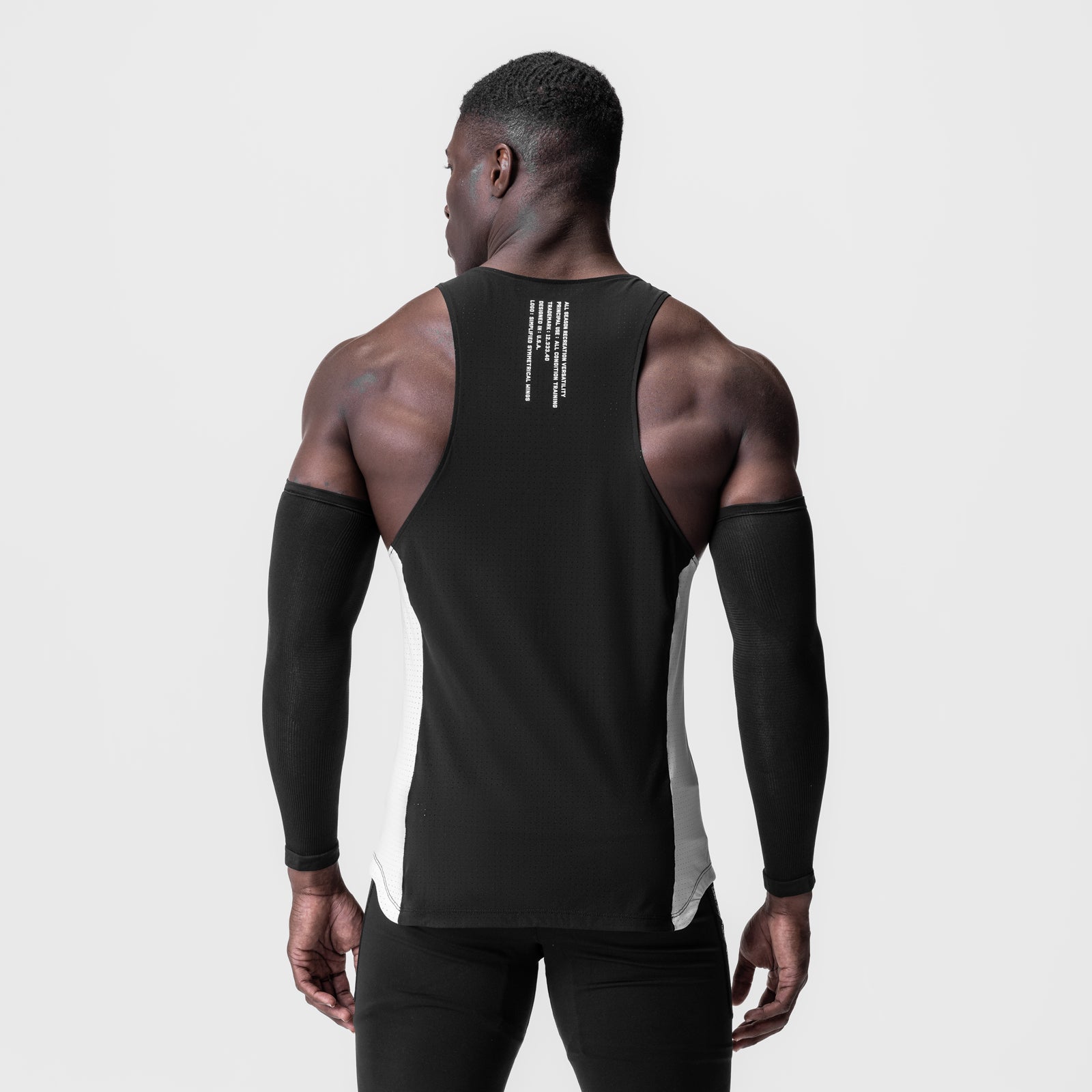 Laser-Vent™ Singlet Tank in black/white, worn by model from behind, showing back design