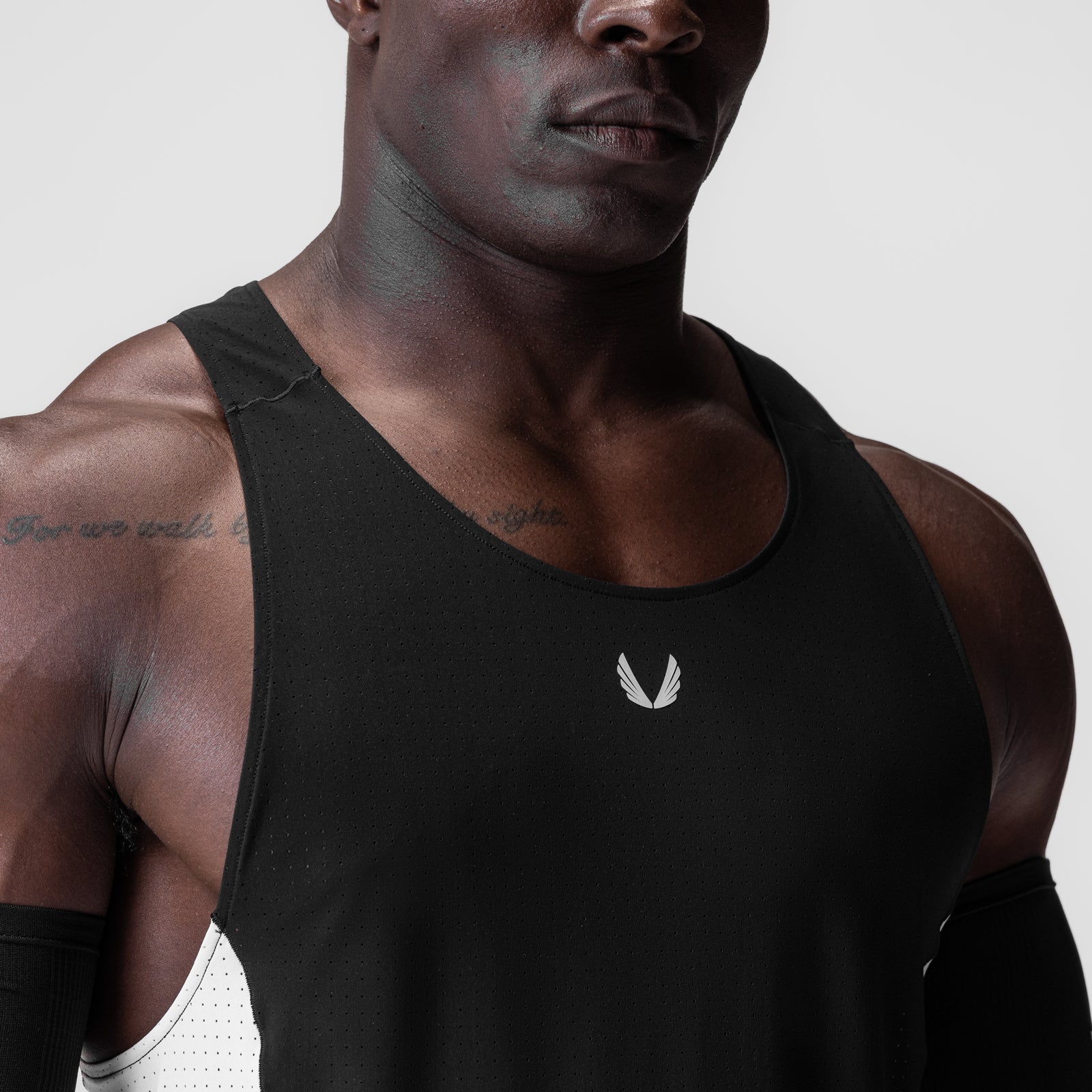 Laser-Vent Singlet Tank in black with white side panels, worn by model