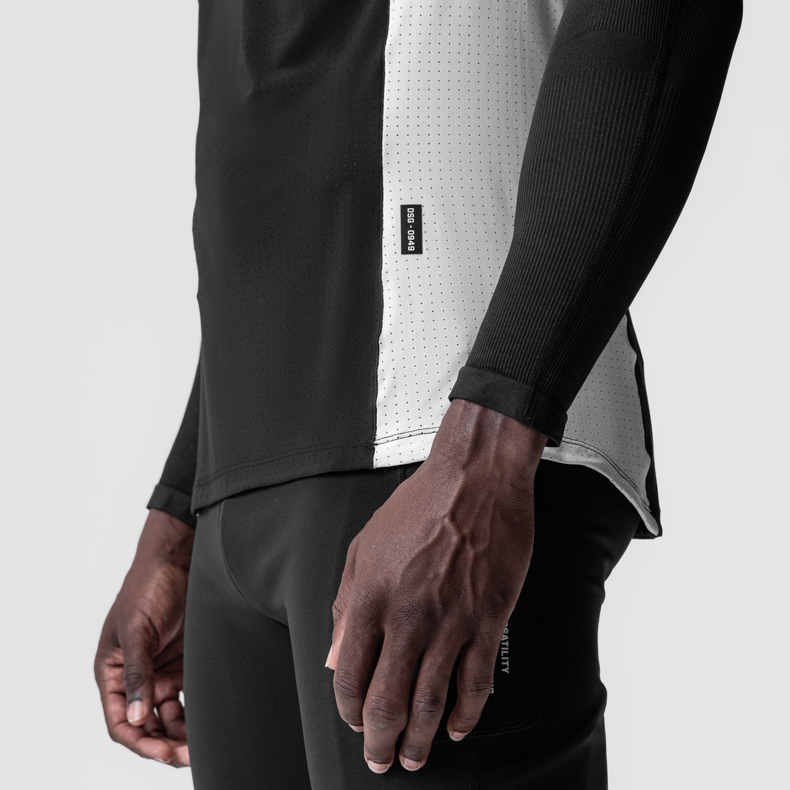 Laser-Vent Singlet Tank in black and white worn by model, side view detail
