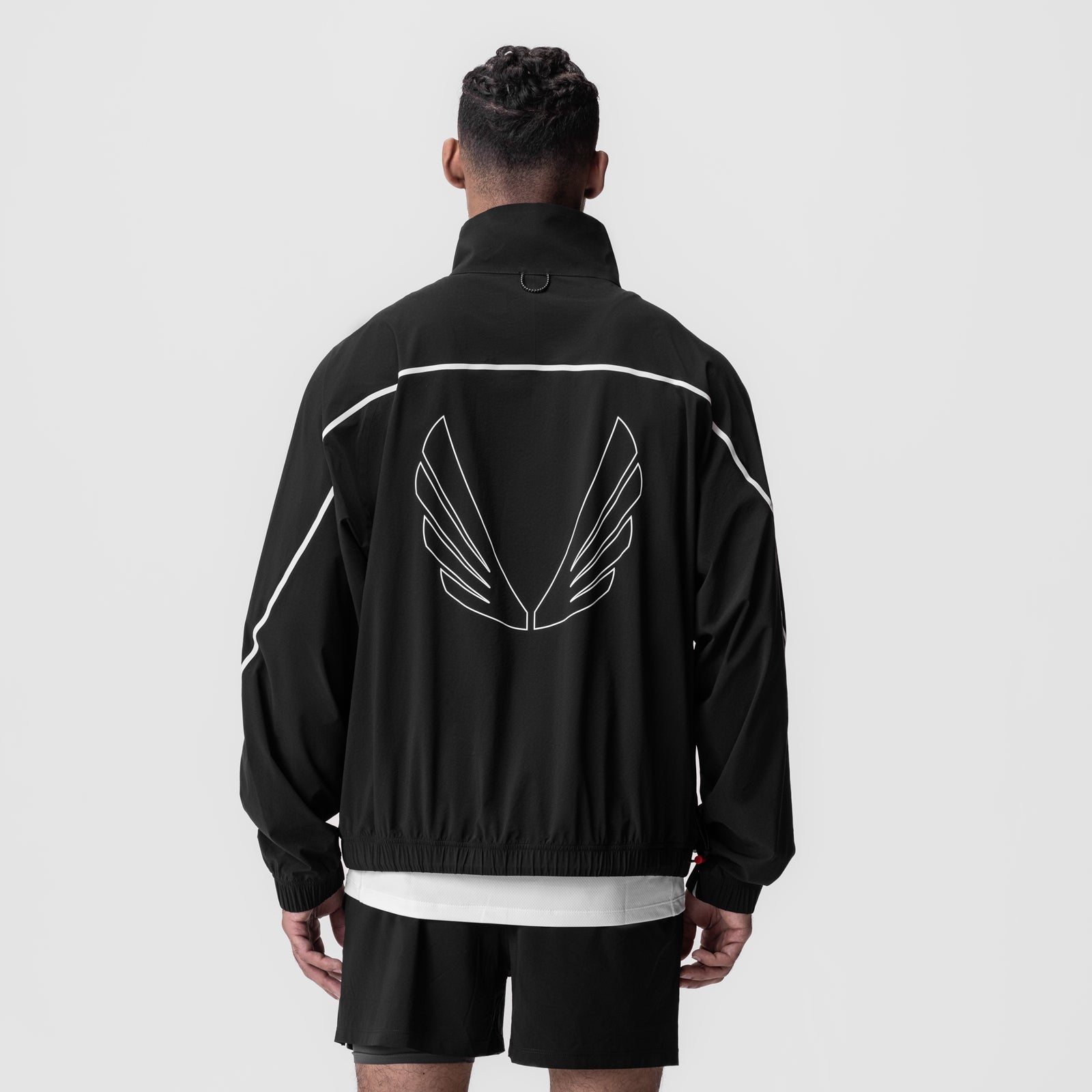 Aerotex Track Jacket in black with white trim, back view on model