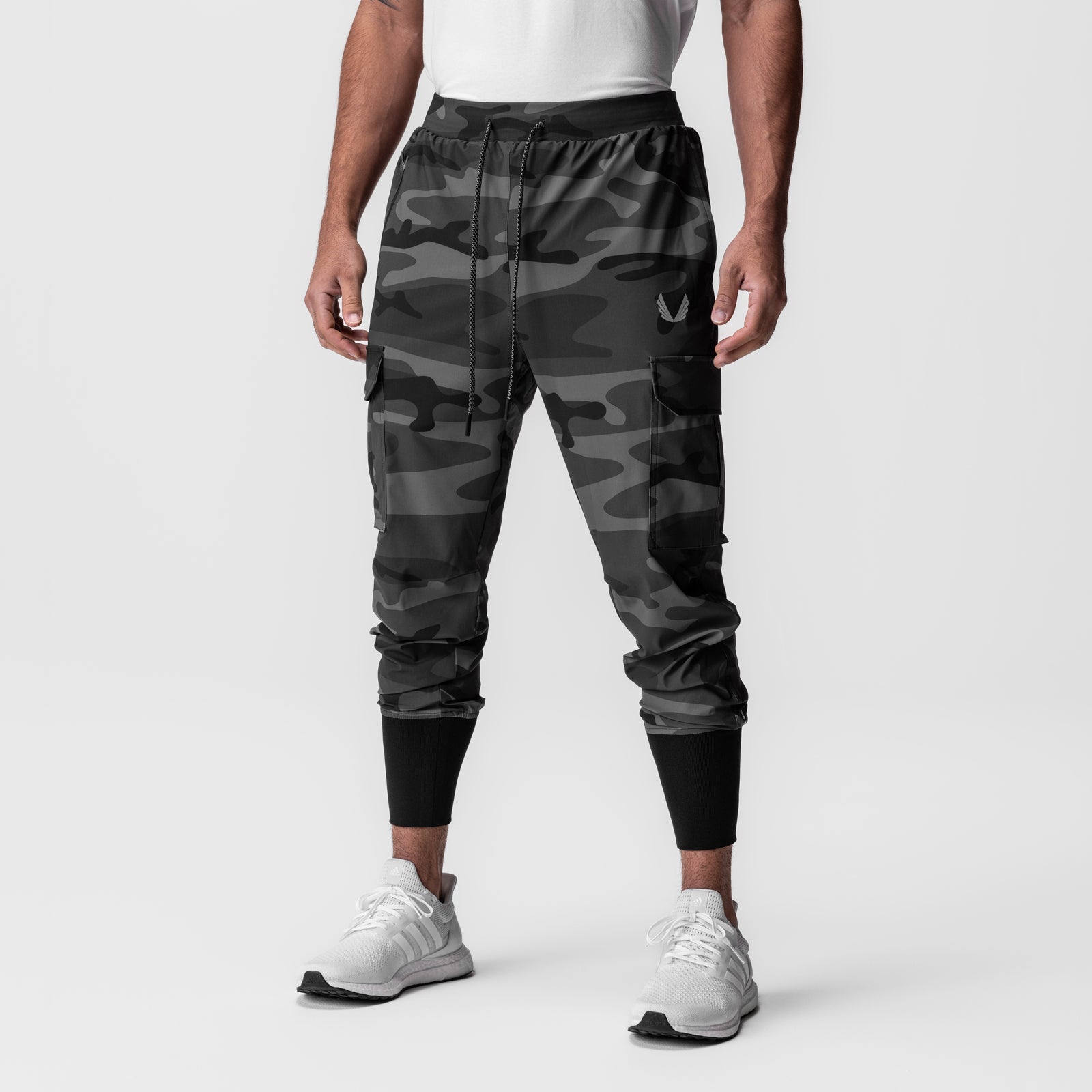 Black camo Tetra-Lite Cargo High Rib Jogger worn by model, front view