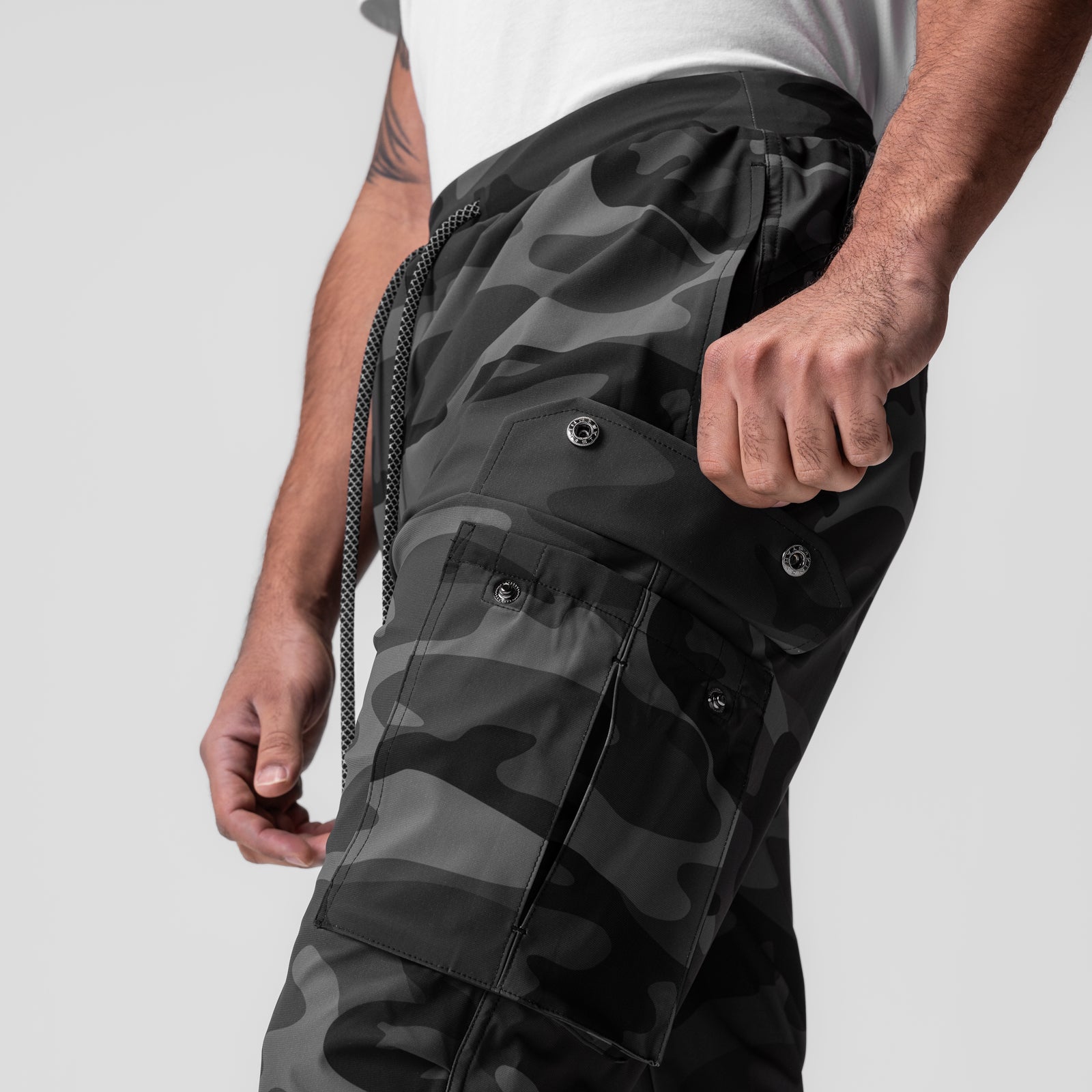 Tetra-Lite Cargo High Rib Jogger in Black Camo Reflective worn by model, side view