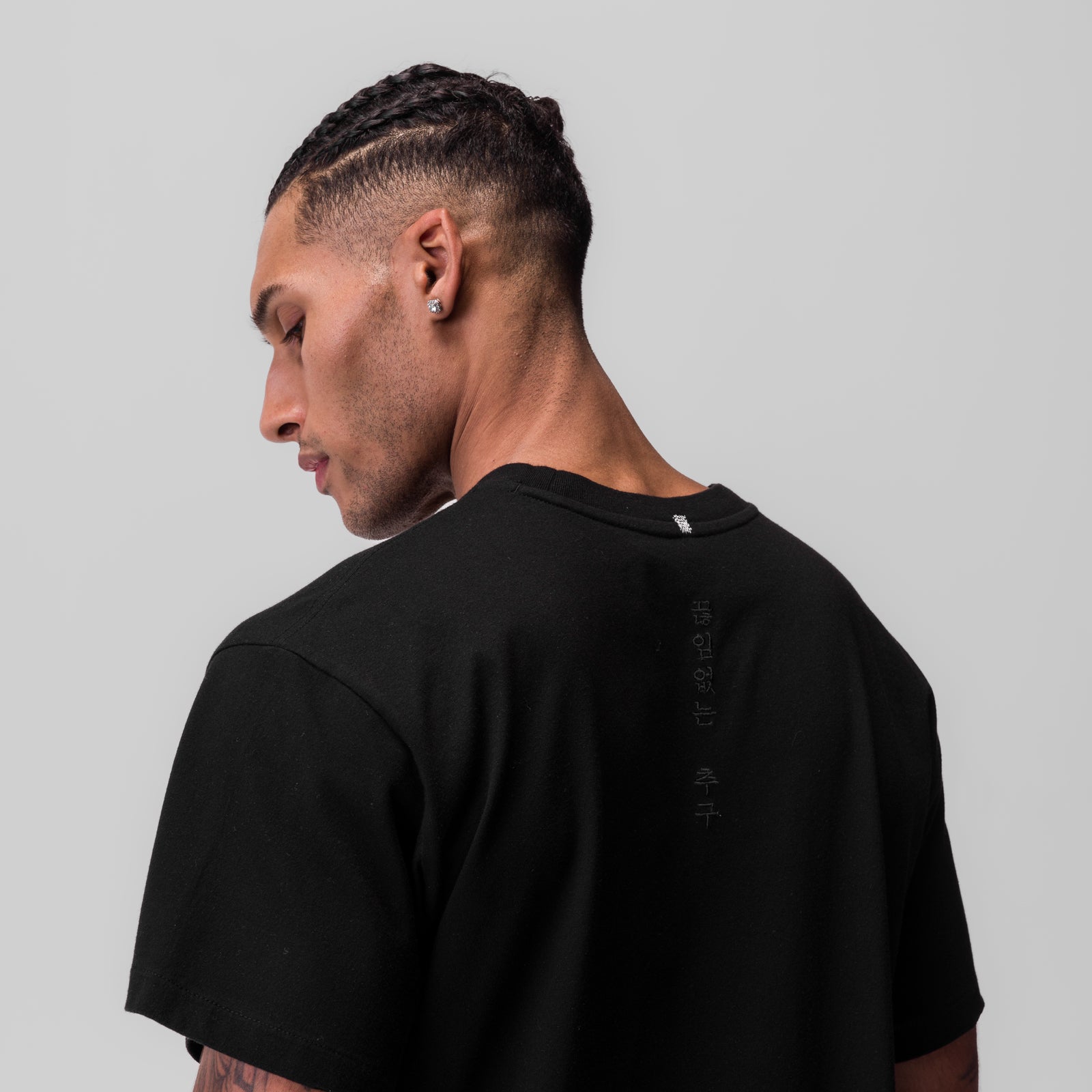 Black Tech Essential Relaxed Tee worn by model, back view