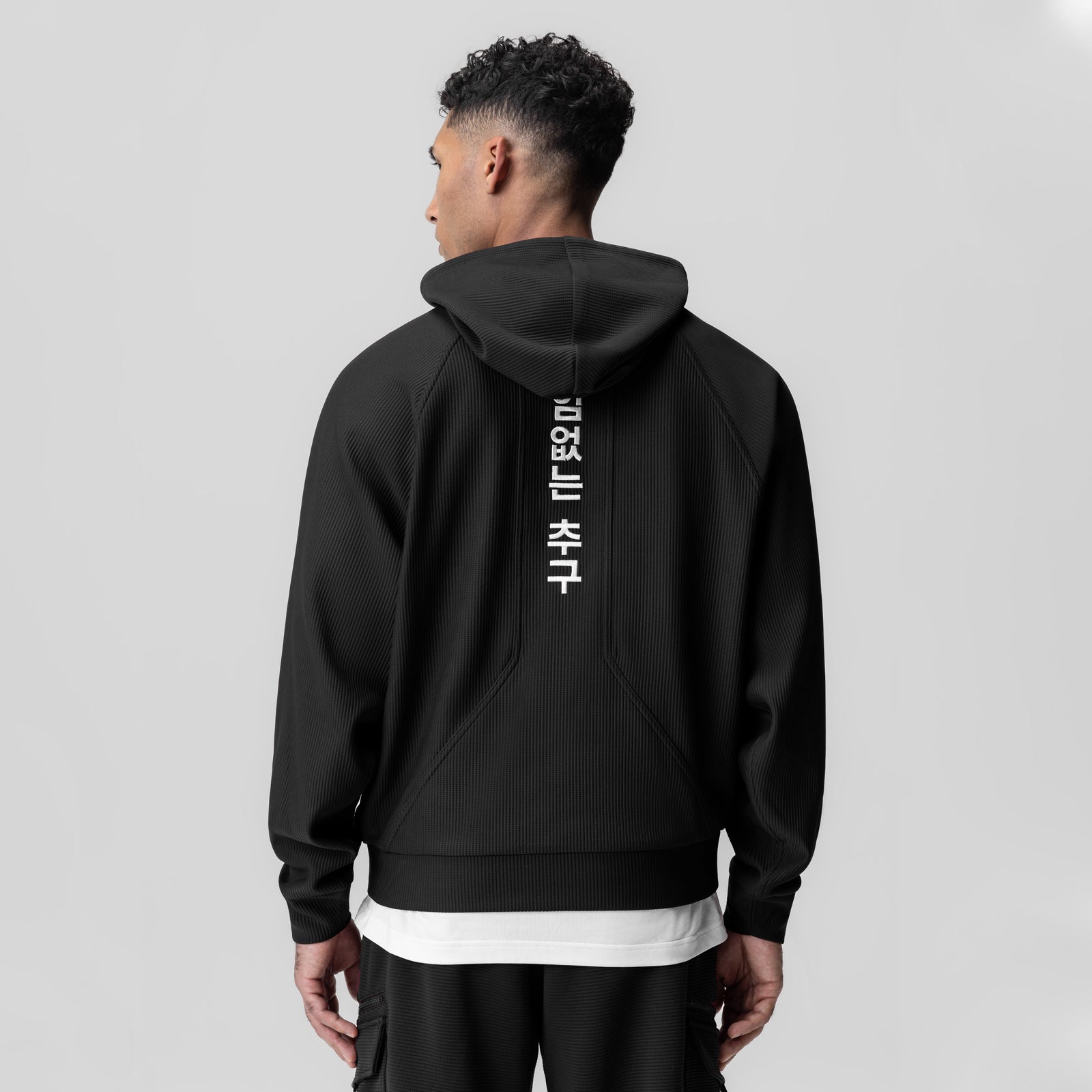 1019 Deltapeak Oversized Hoodie in black, worn by model shown from back view