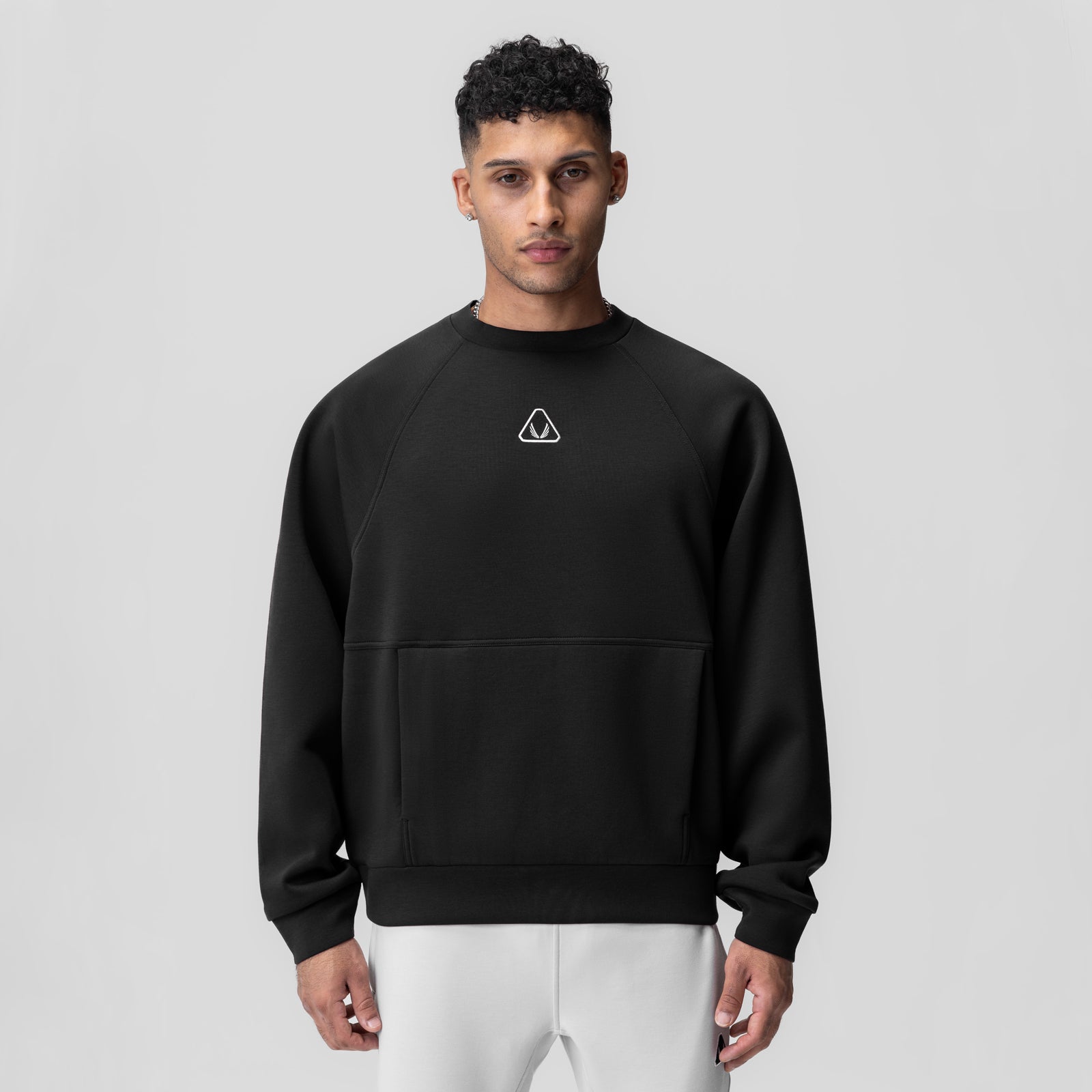 Black Dri-Core™ oversized crewneck worn by model, front view