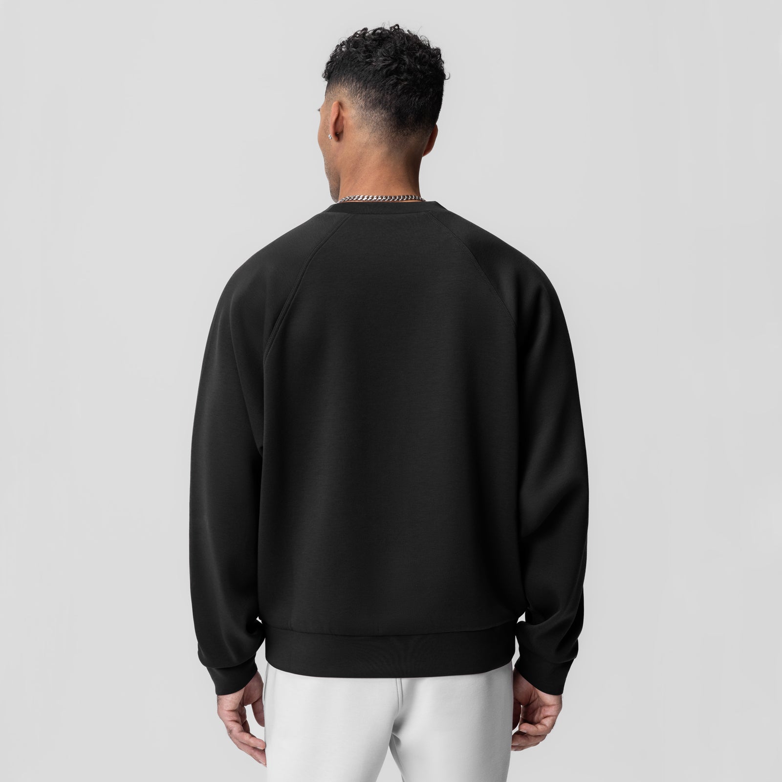 Dri-Core™ Oversized Crewneck in black, back view on model