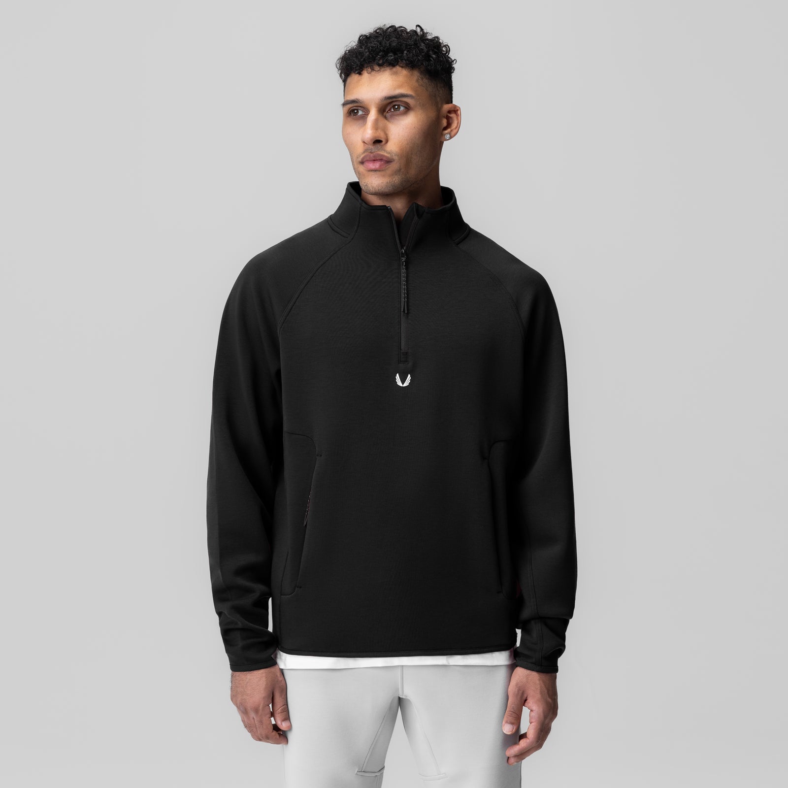 Dri-Core Quarter Zip in black worn by male model, front view