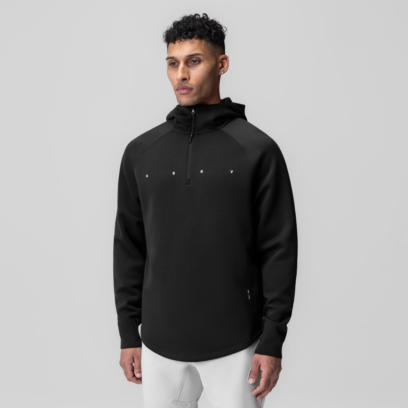 Black Dri-Core™ Zip Hoodie worn by male model, front view against grey background