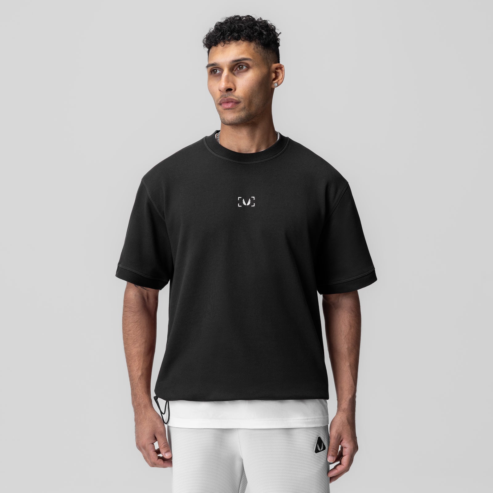 Herringbone Terry Oversized Cinch Tee in black, worn by model, front view
