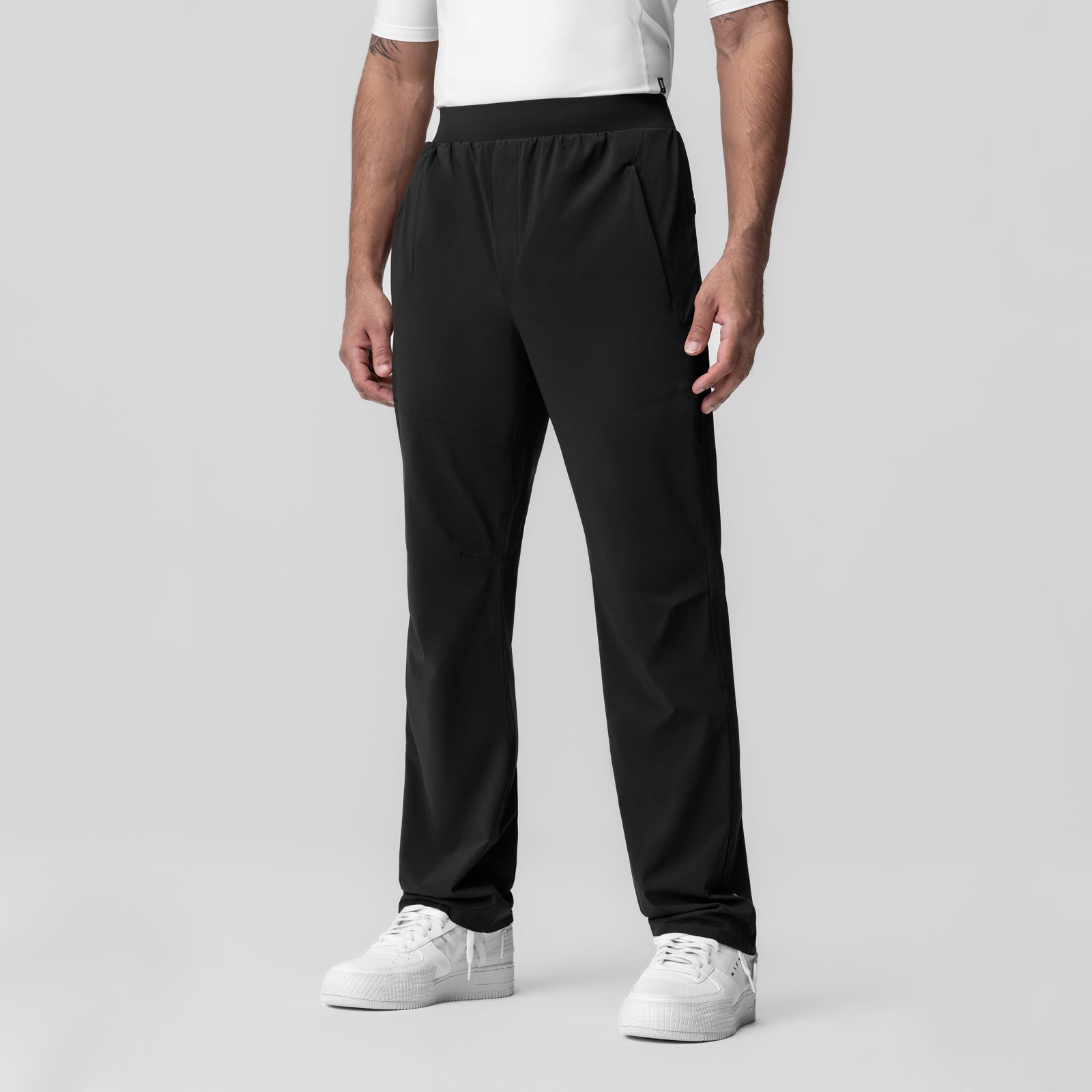 Black Aerotex Weather-Ready Bonded Pant worn by model with white sneakers, front view