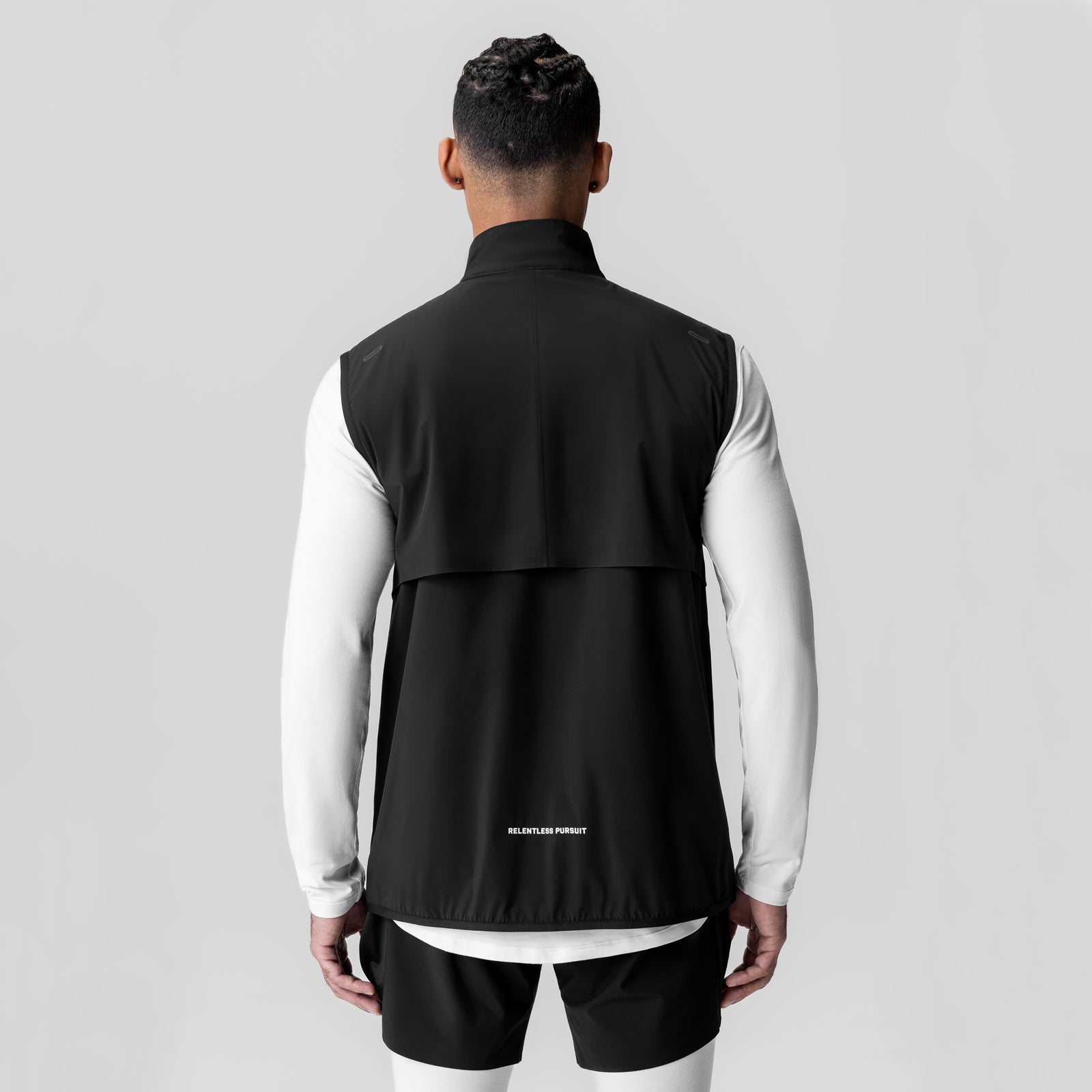 Aerotex PrimaLoft Run Vest in black, worn by model from back view