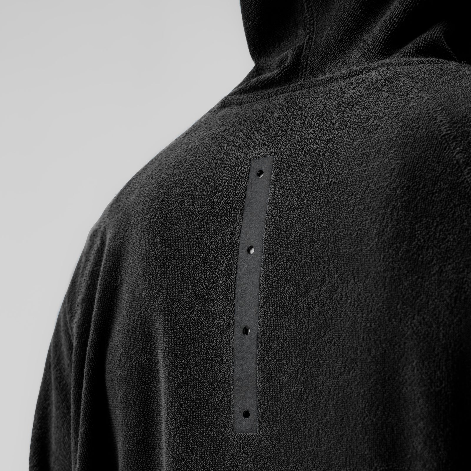 Towel Terry Reversible Hoodie in black, back detail view showing button placket