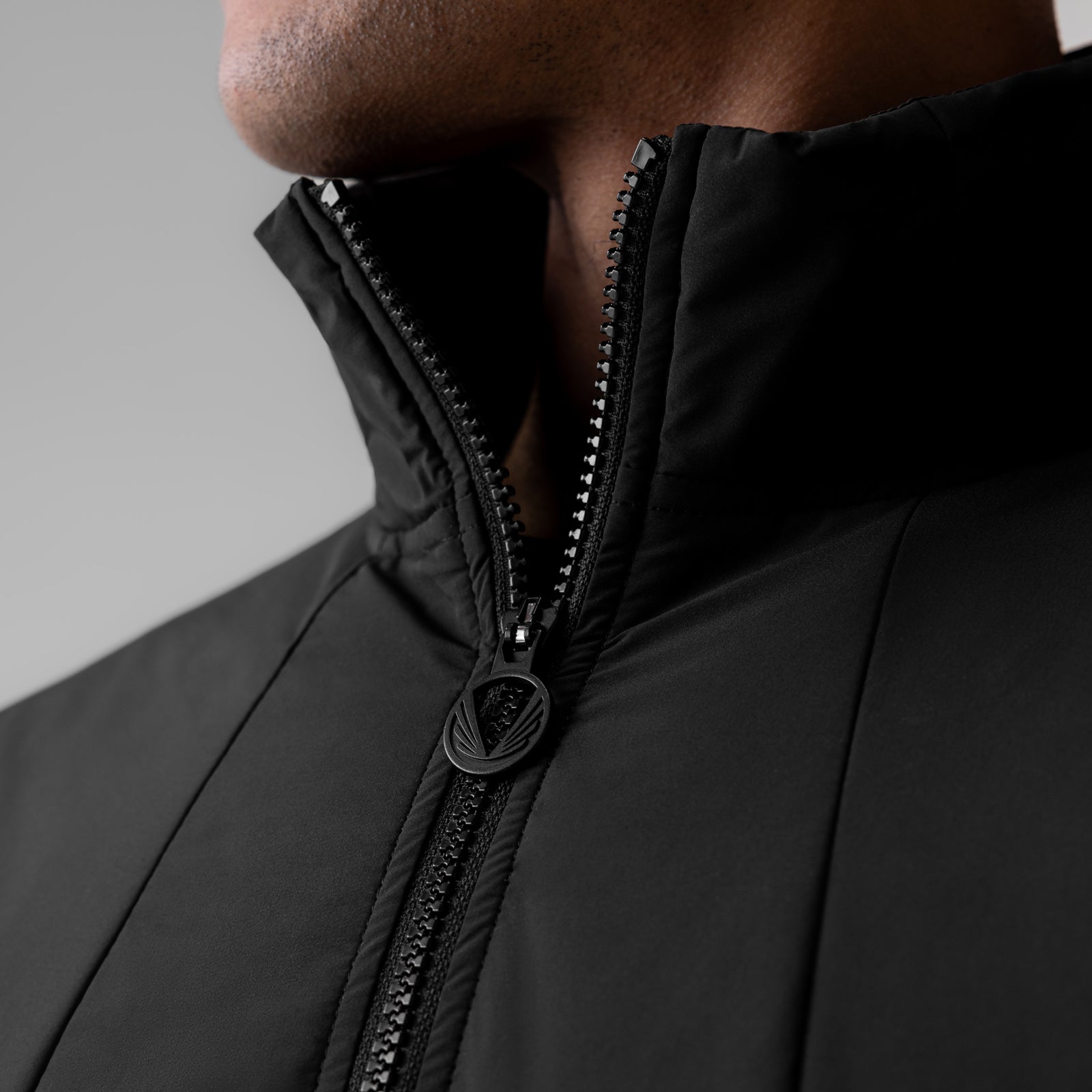 Aerotex PrimaLoft Quarter Zip in black, worn by model, showing zipper detail