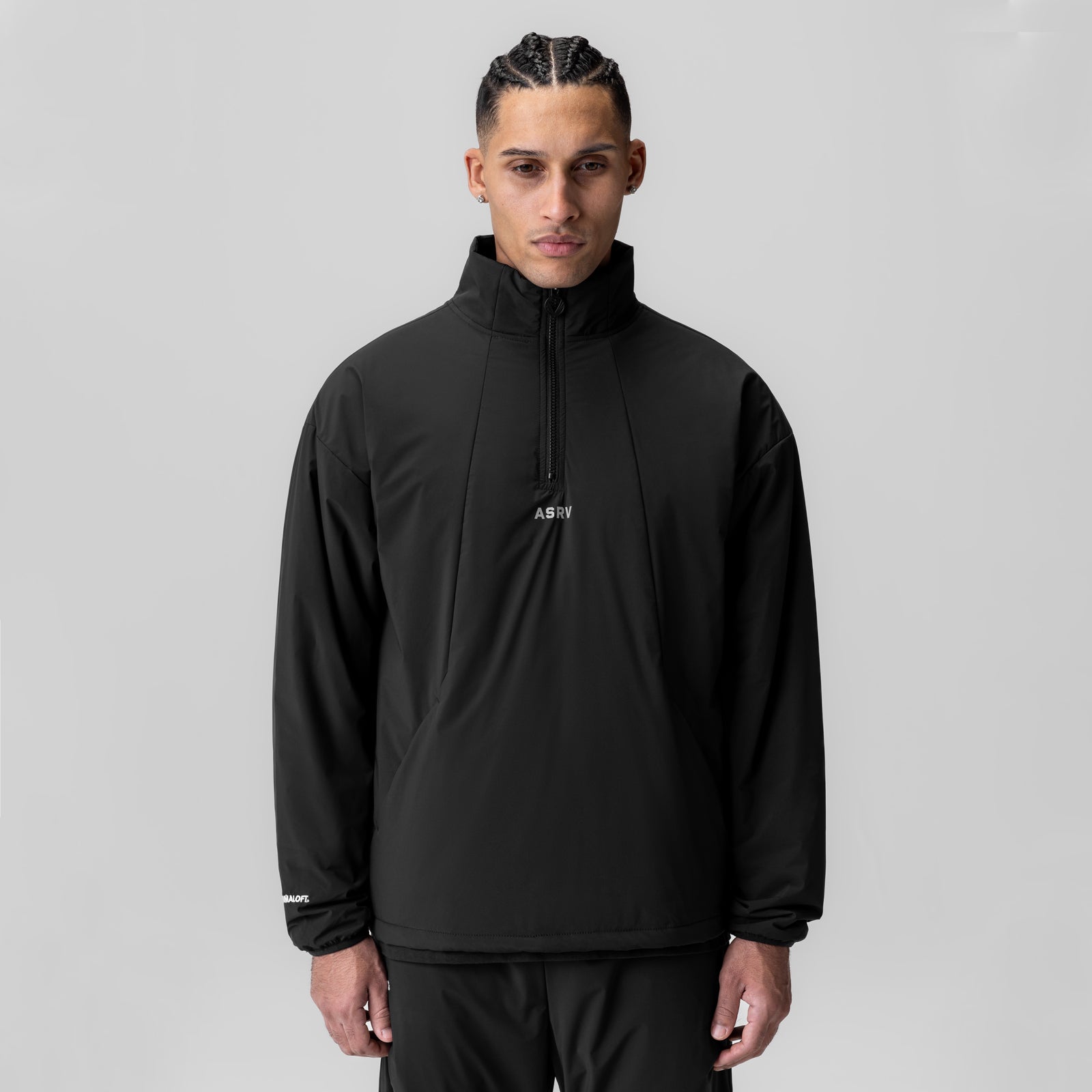 Aerotex PrimaLoft Quarter Zip in black, worn by model, front view