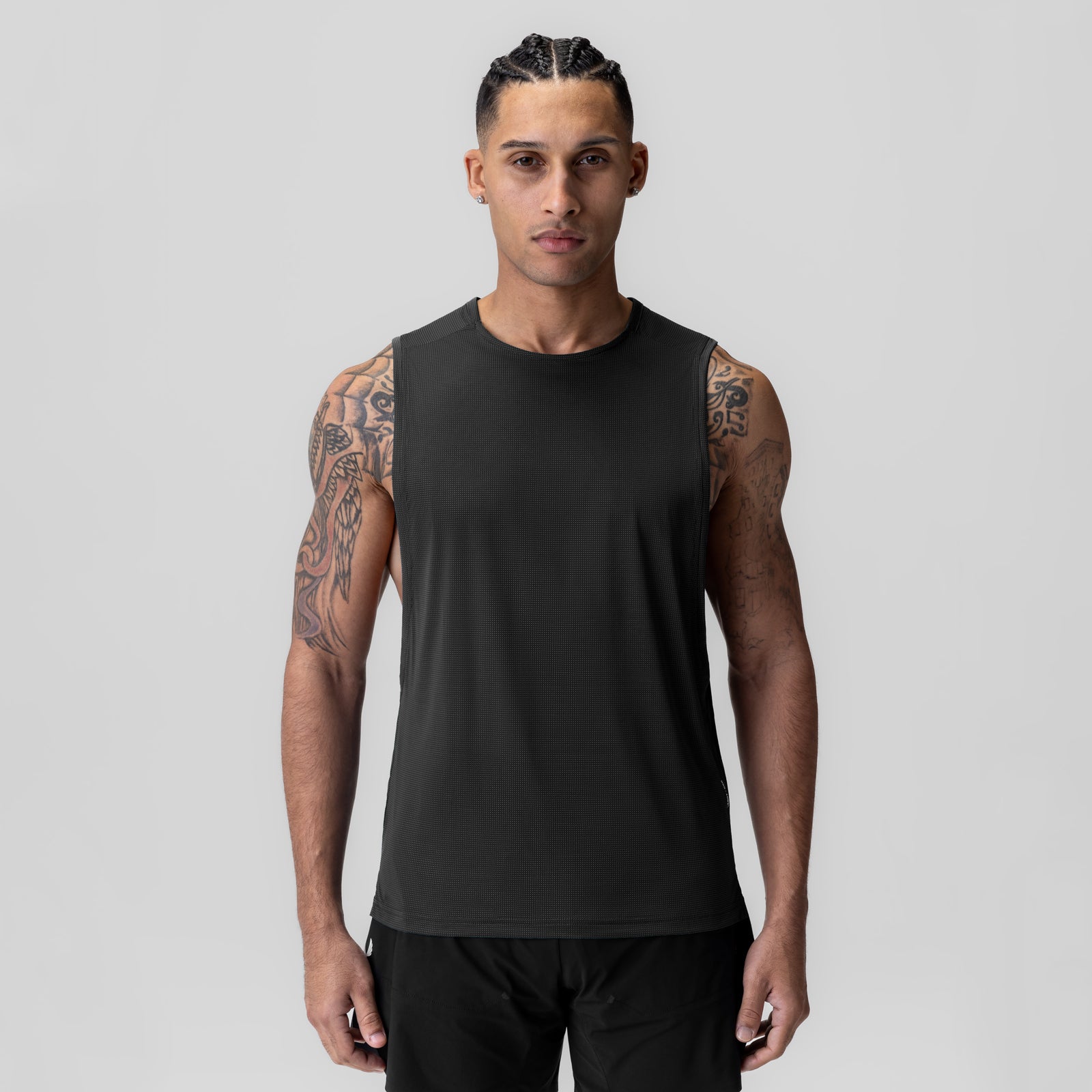 Black Ice-Skin™ Muscle Tank worn by male model, front view