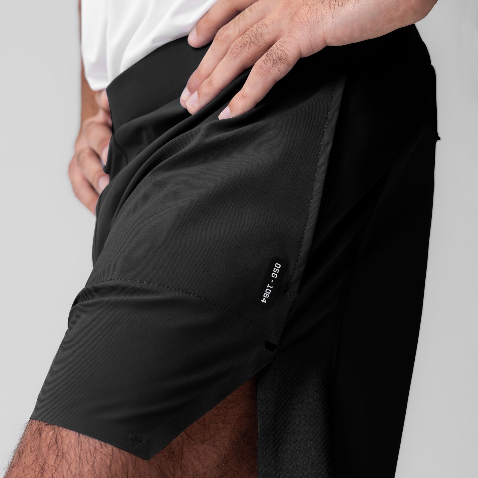 Tetra-Lite 6" Bonded Training Short in black, worn by model showing side pocket detail