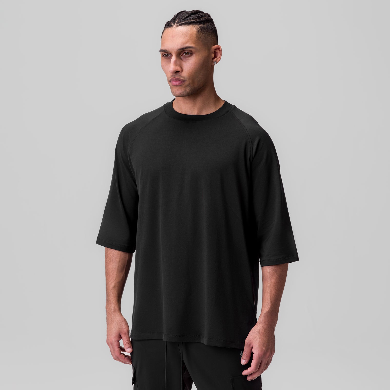 Black Supima® 3/4-sleeve oversized tee worn by model, front view