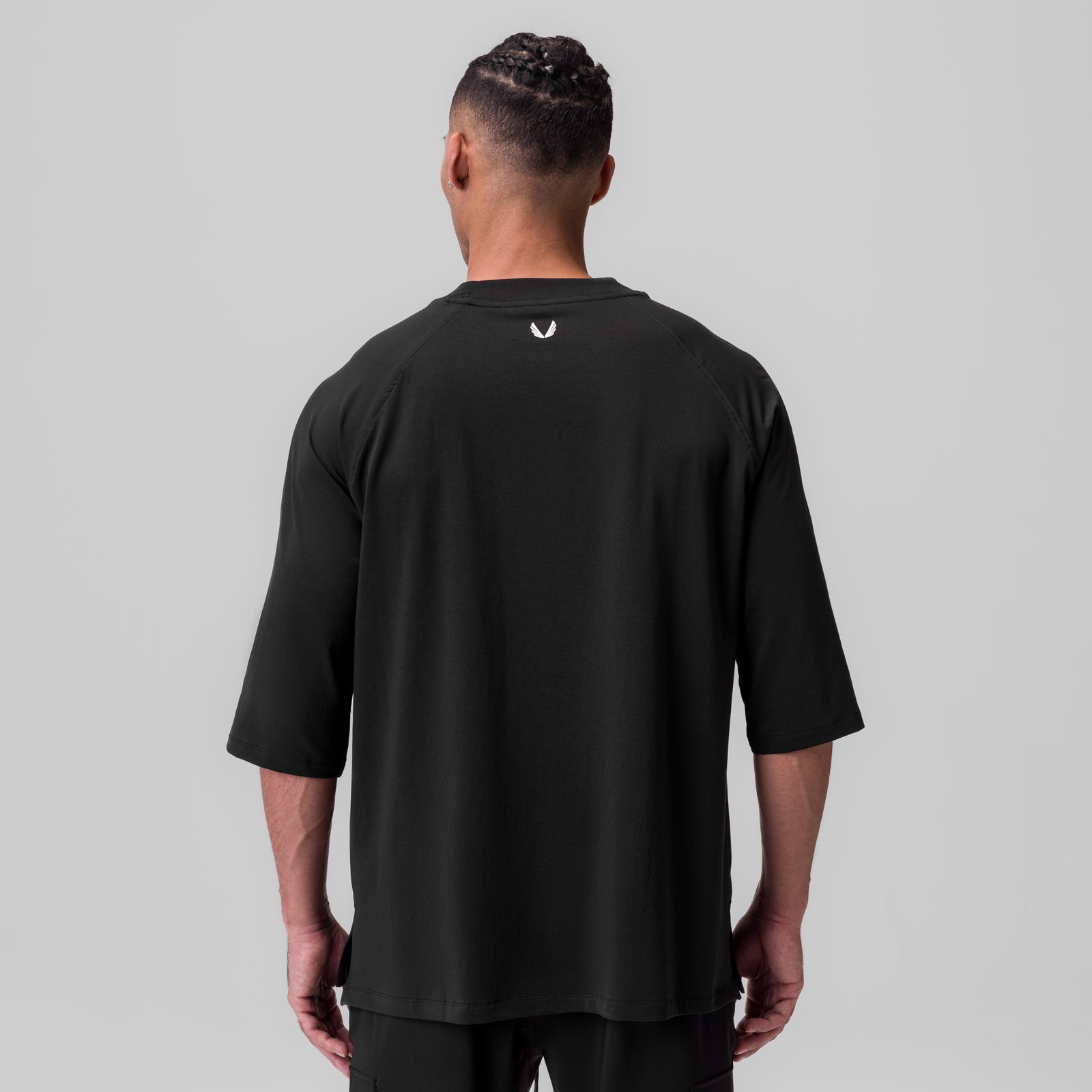 Black Supima® 3/4-sleeve oversized tee on model, back view