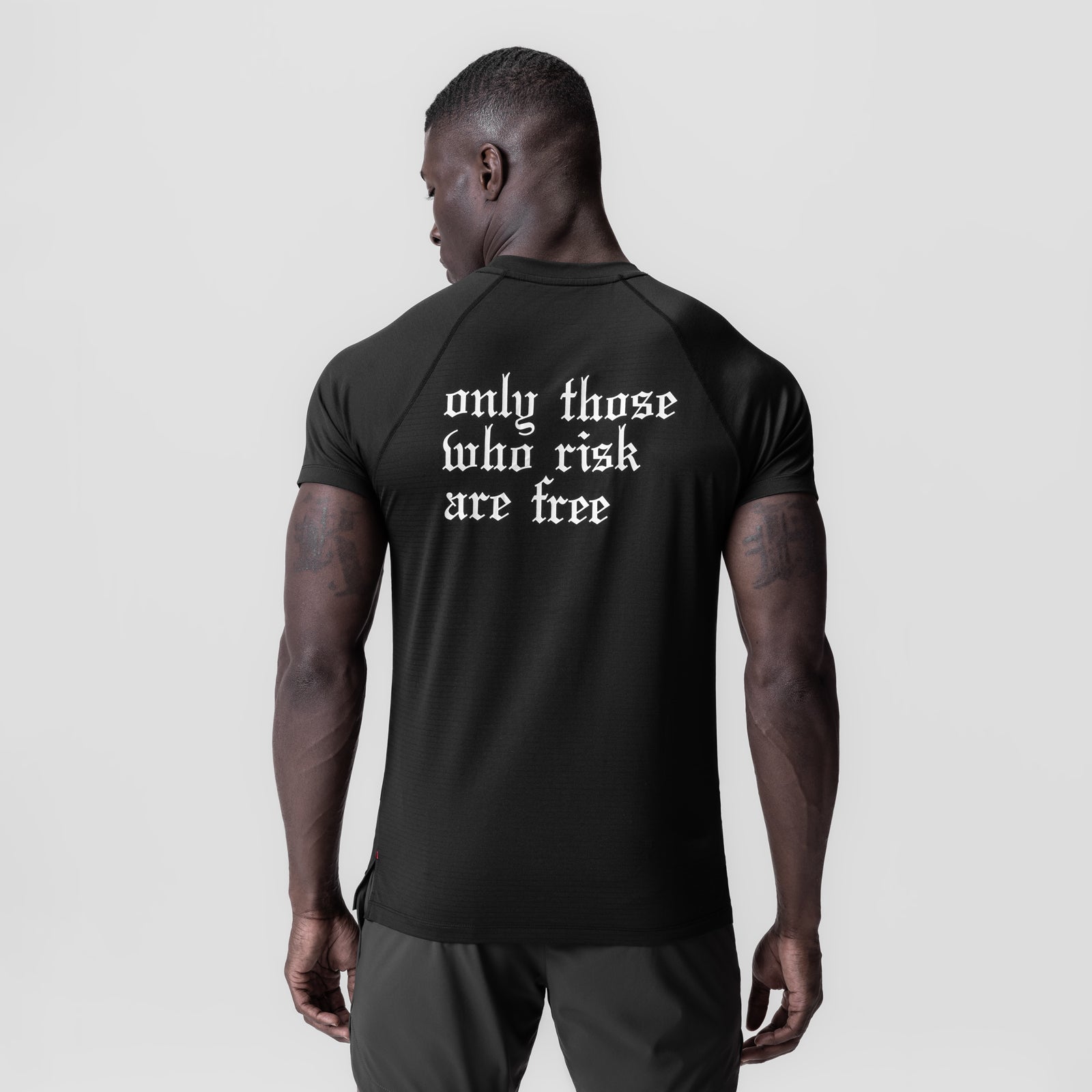 Black 3D-Lite® 2.0 Lycra® Fitted Tee with 'only those who risk are free' text, back view on model