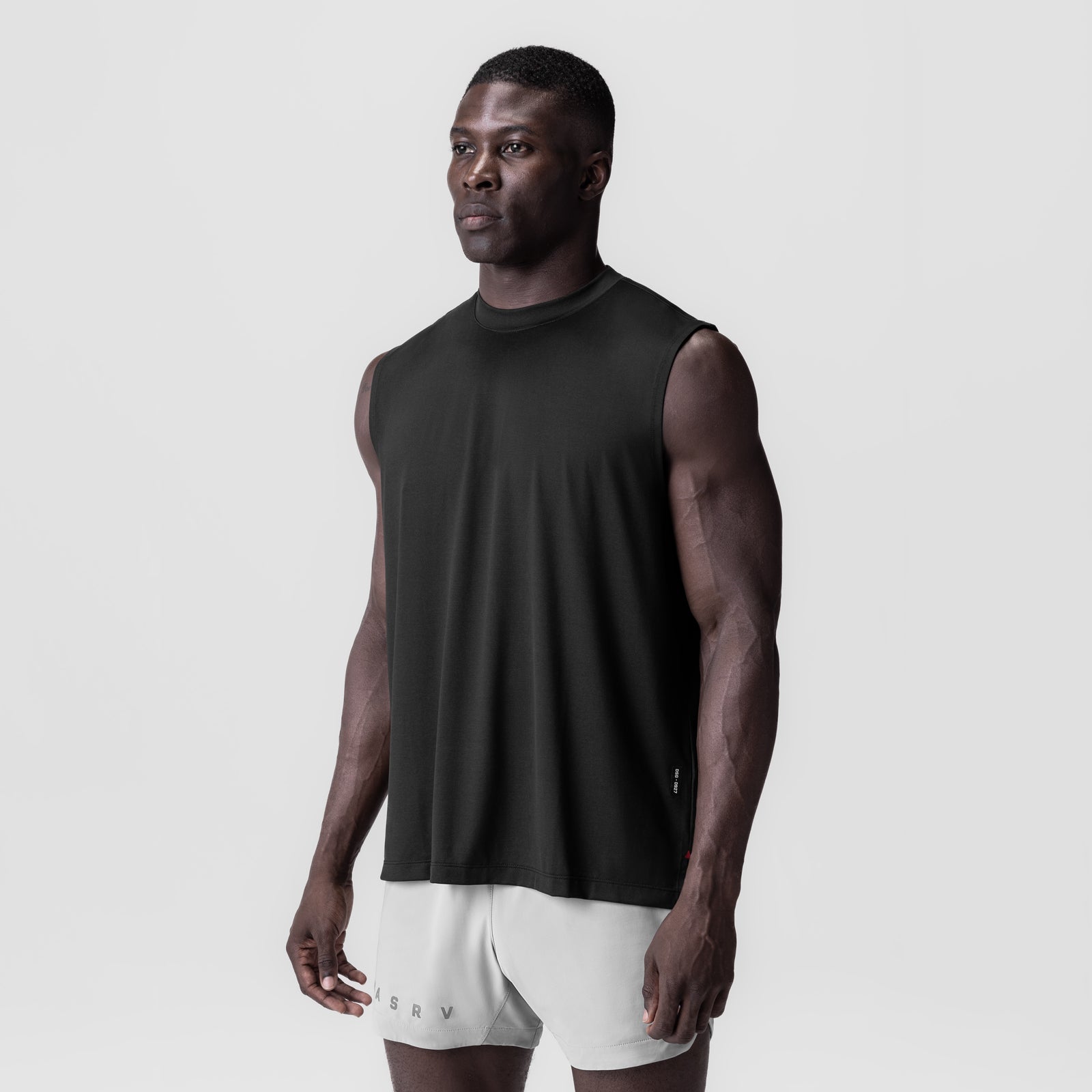 Black 3D-Lite® 2.0 Lycra® Relaxed Cutoff tank top worn by male model, front view