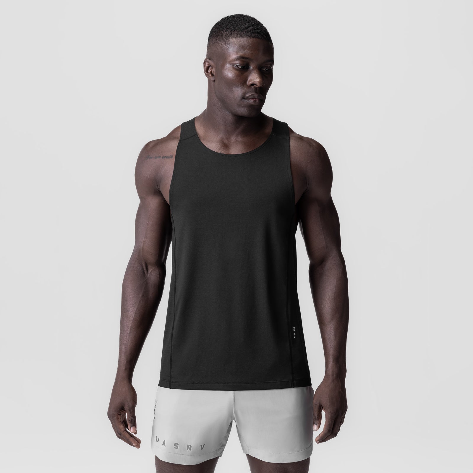 Black 3D-Lite® 2.0 Lycra® Pro Singlet worn by male model with light grey shorts, front view