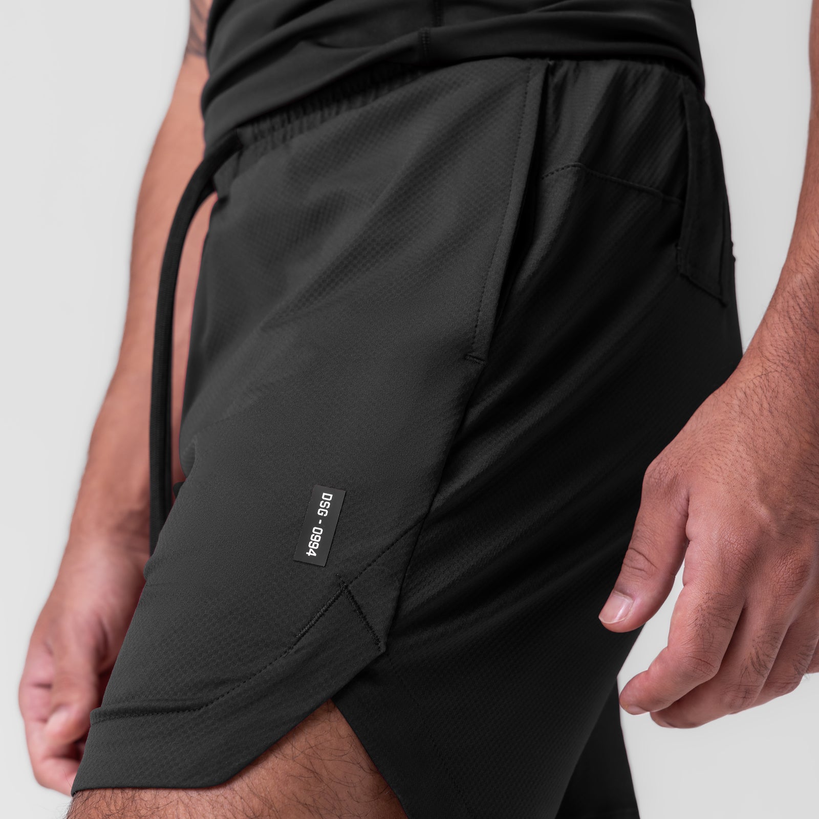 Black AeroSilver 7" linerless shorts worn by model, side view detail