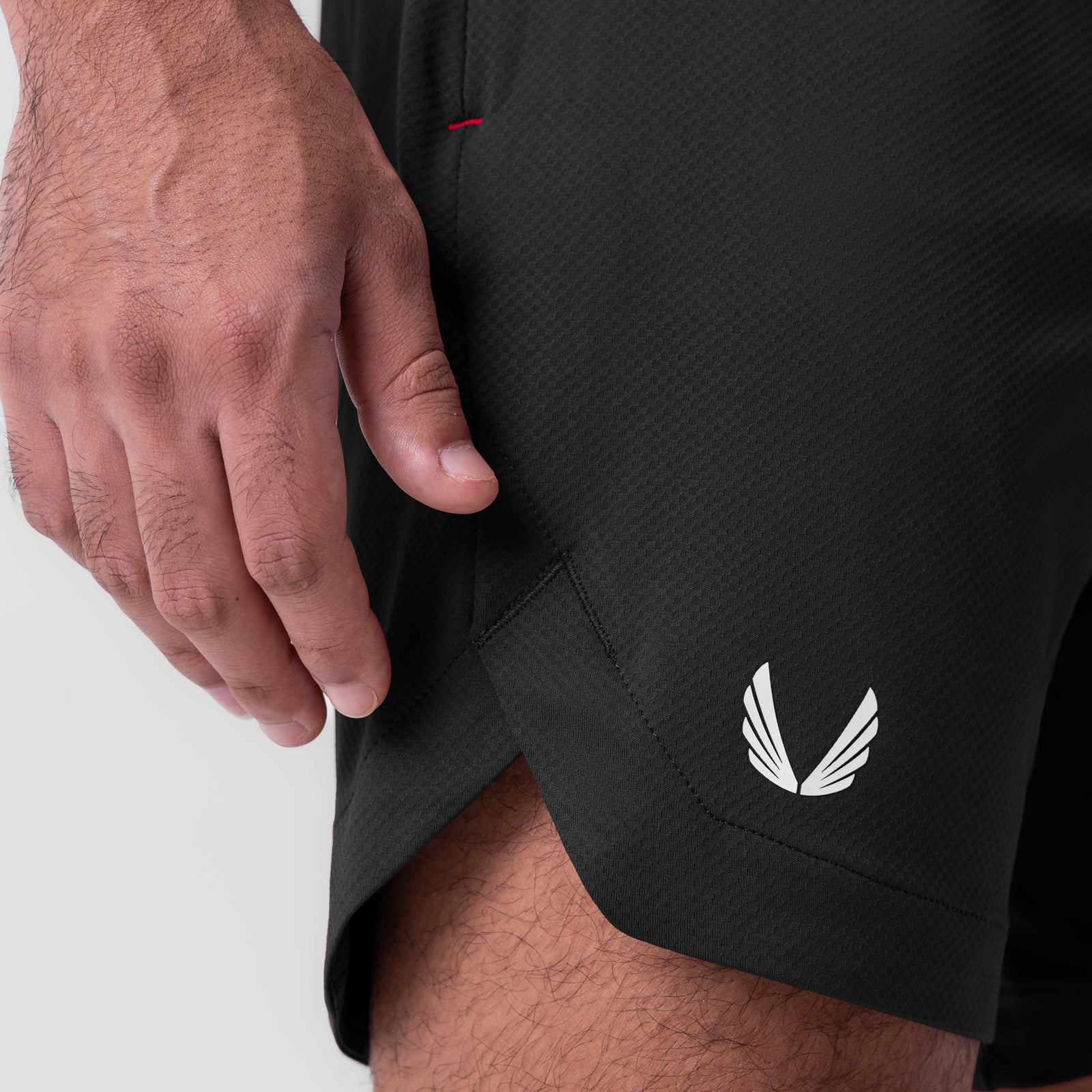 AeroSilver 7" linerless shorts in black, worn by model showing side pocket detail