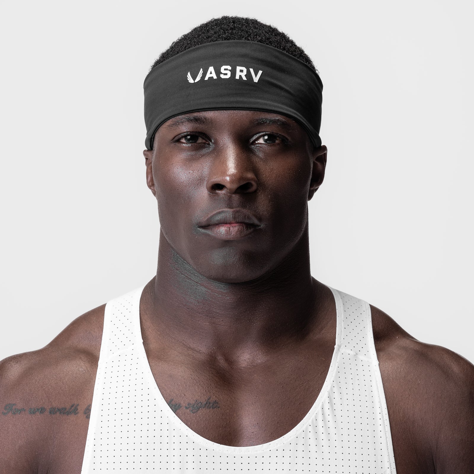 WarpFlexx Headband in black worn by male model with white tank top, front view