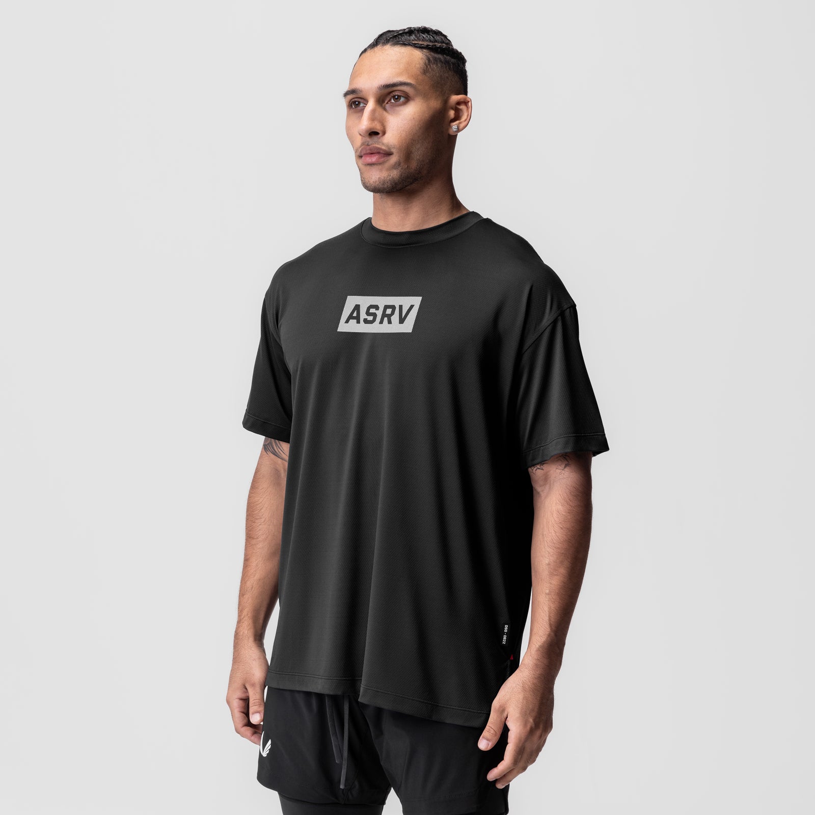 AeroSilver Oversized Tee in black with ASRV box logo, worn by model, front view