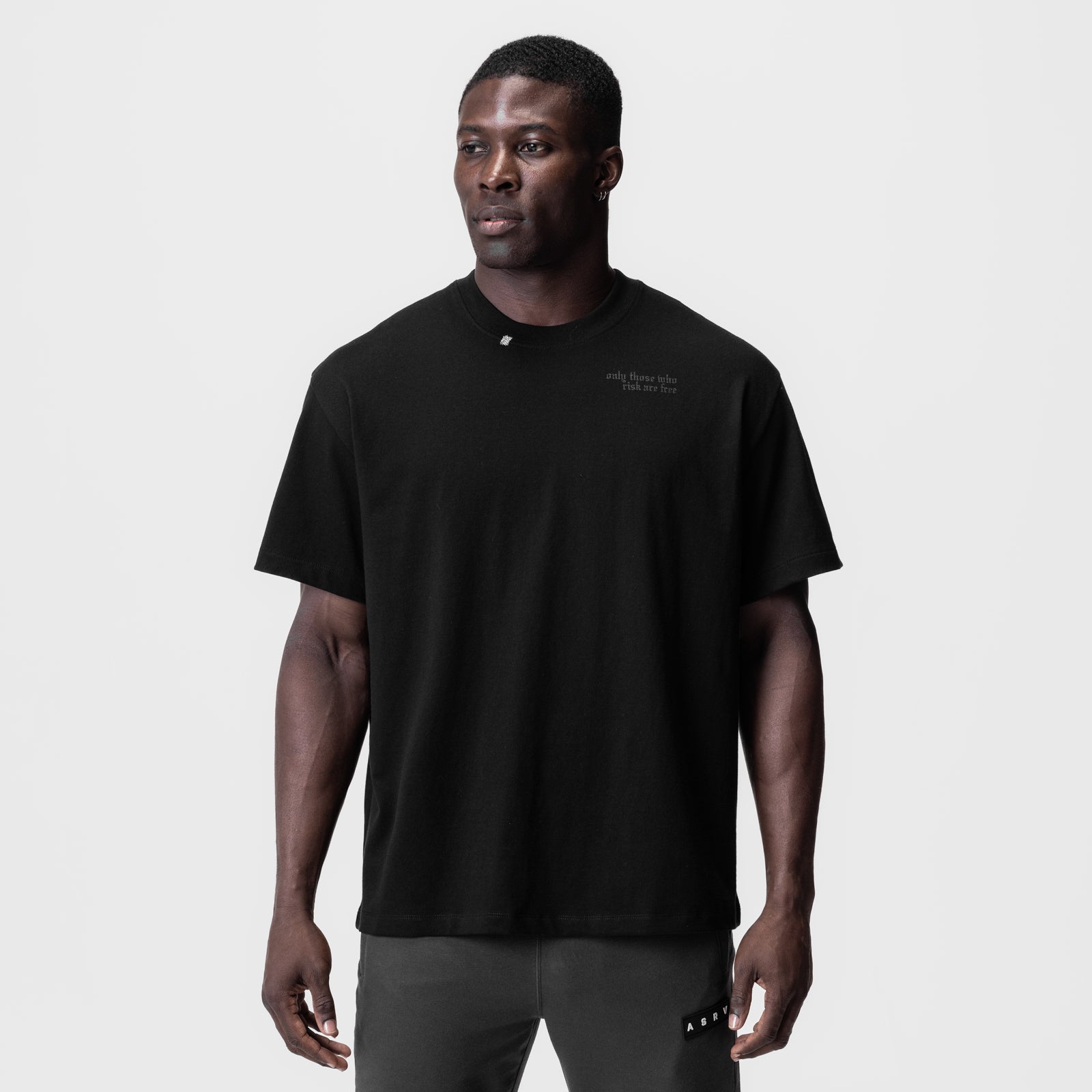 Black Tech Essential Relaxed Tee worn by model, front view